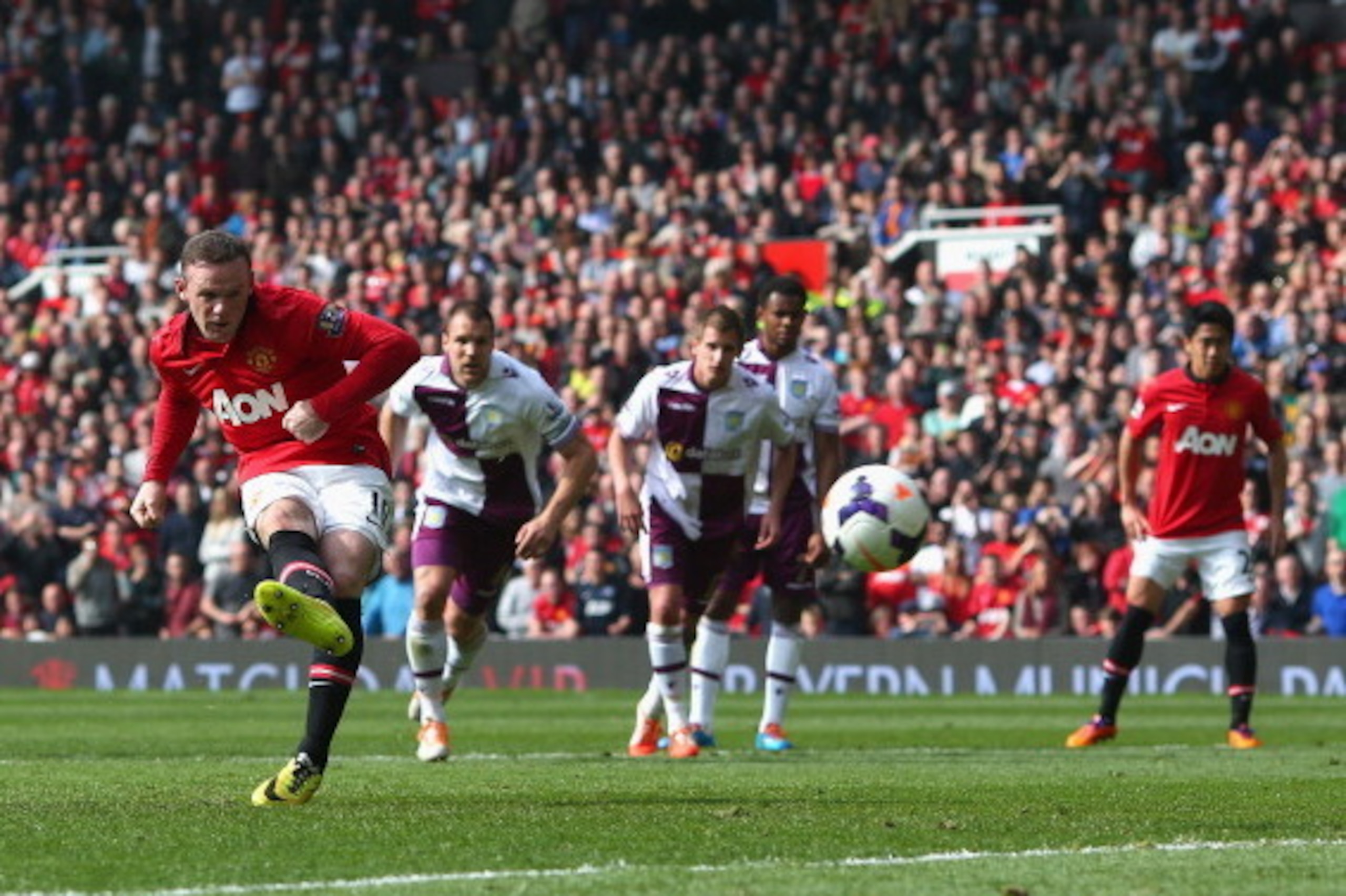 MANCHESTER, ENGLAND - MARCH 29:  Wayne Rooney of Manchester United scores his team's second goal from a penalty kick during the Barclays Premier League match between Manchester United and Aston Villa at Old Trafford on March 29, 2014 in Manchester, Englan