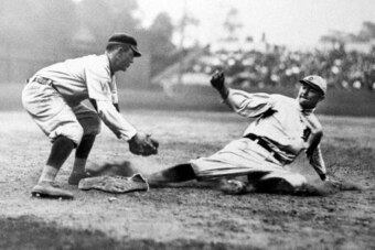 Ty Cobb sliding into third base