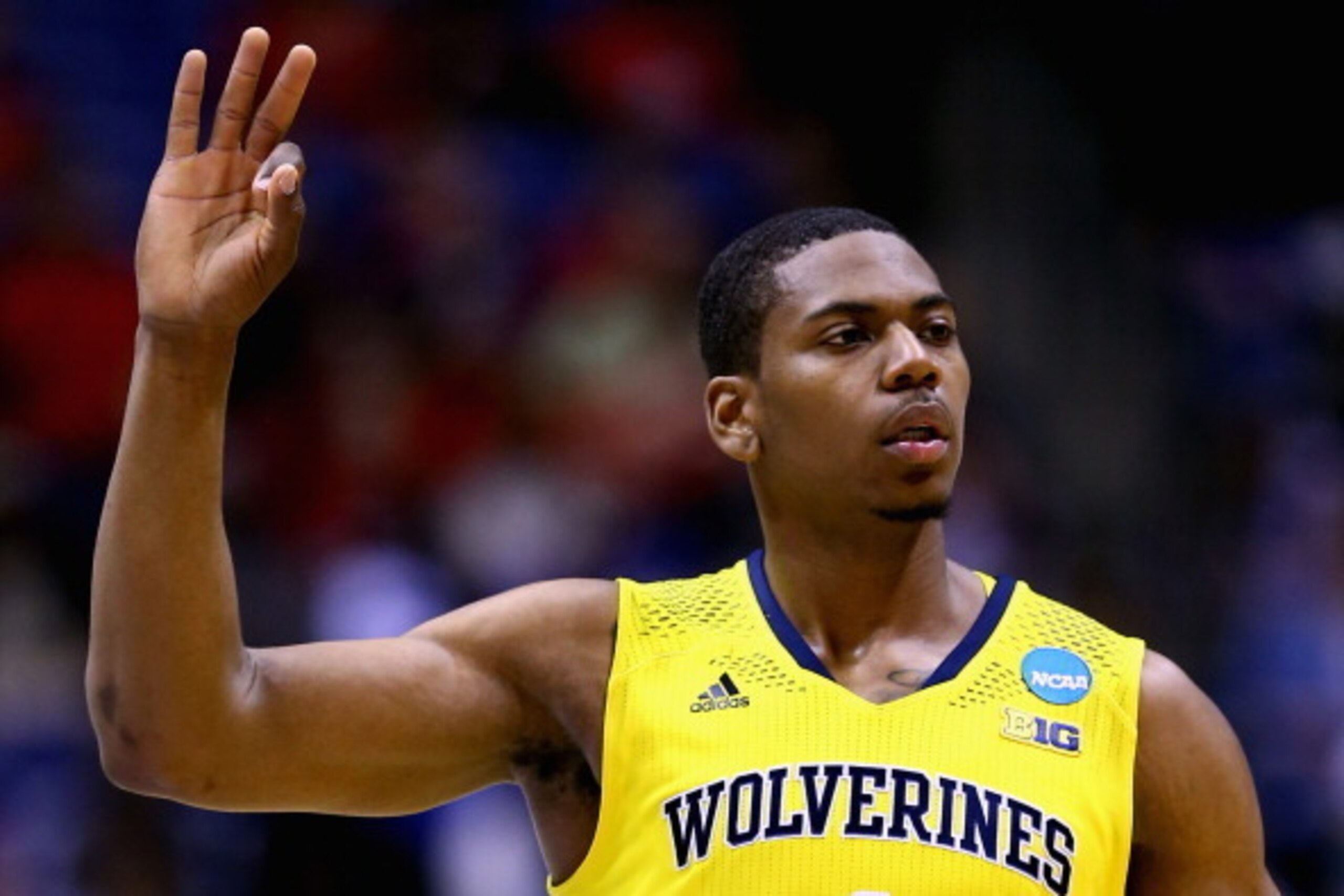 INDIANAPOLIS, IN - MARCH 28: Glenn Robinson III #1 of the Michigan Wolverines celebrates a three pointer in the first half against the Tennessee Volunteers during the regional semifinal of the 2014 NCAA Men's Basketball Tournament at Lucas Oil Stadium on INDIANAPOLIS, IN - MARCH 28: Glenn Robinson III #1 of the Michigan Wolverines celebrates a three pointer in the first half against the Tennessee Volunteers during the regional semifinal of the 2014 NCAA Men's Basketball Tournament at Lucas Oil Stadium on