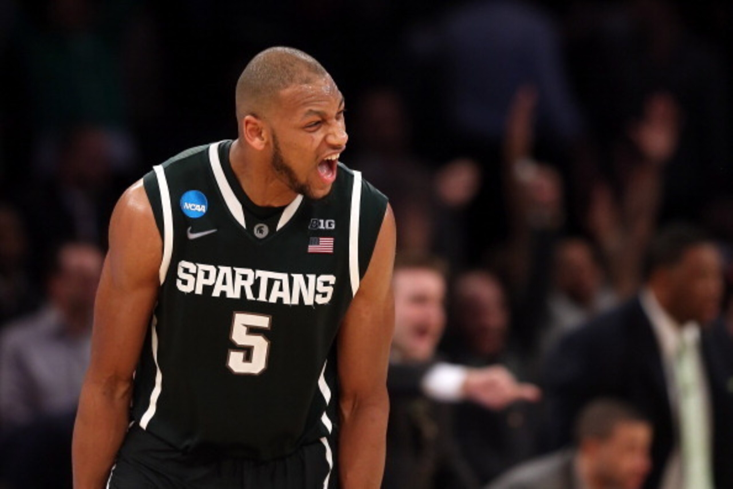 NEW YORK, NY - MARCH 28:  Adreian Payne #5 of the Michigan State Spartans reacts after hitting a three pointer late in the game against Virginia Cavaliers during the regional semifinal of the 2014 NCAA Men's Basketball Tournament at Madison Square Garden 