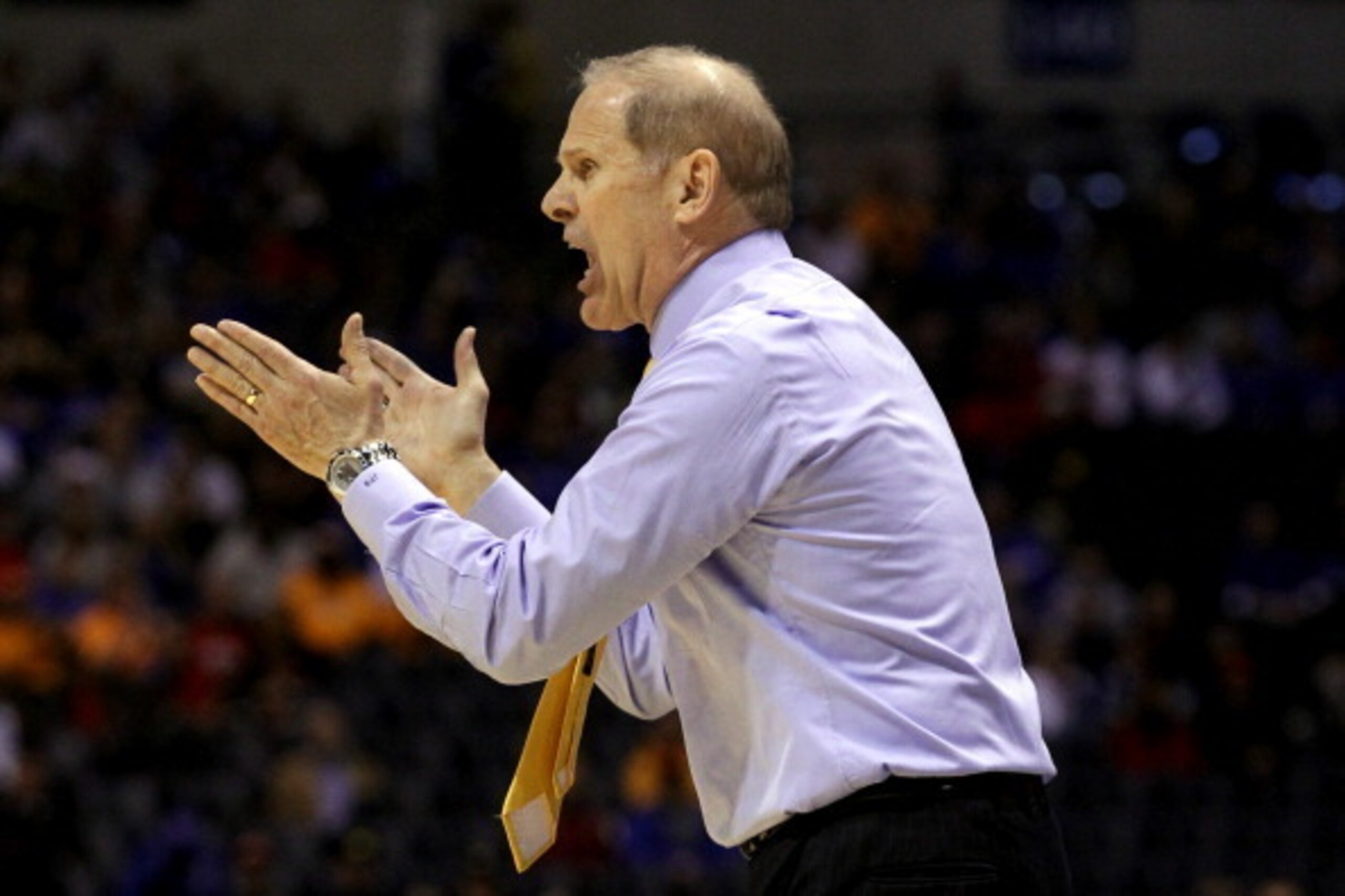 INDIANAPOLIS, IN - MARCH 28:  Head coach John Beilein of the Michigan Wolverines shouts to his team in the first half against the Tennessee Volunteers during the regional semifinal of the 2014 NCAA Men's Basketball Tournament at Lucas Oil Stadium on March