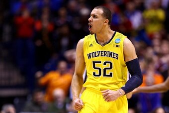 INDIANAPOLIS, IN - MARCH 28:  Jordan Morgan #52 of the Michigan Wolverines reacts against Tennessee Volunteers during the regional semifinal of the 2014 NCAA Men's Basketball Tournament at Lucas Oil Stadium on March 28, 2014 in Indianapolis, Indiana.  (Ph