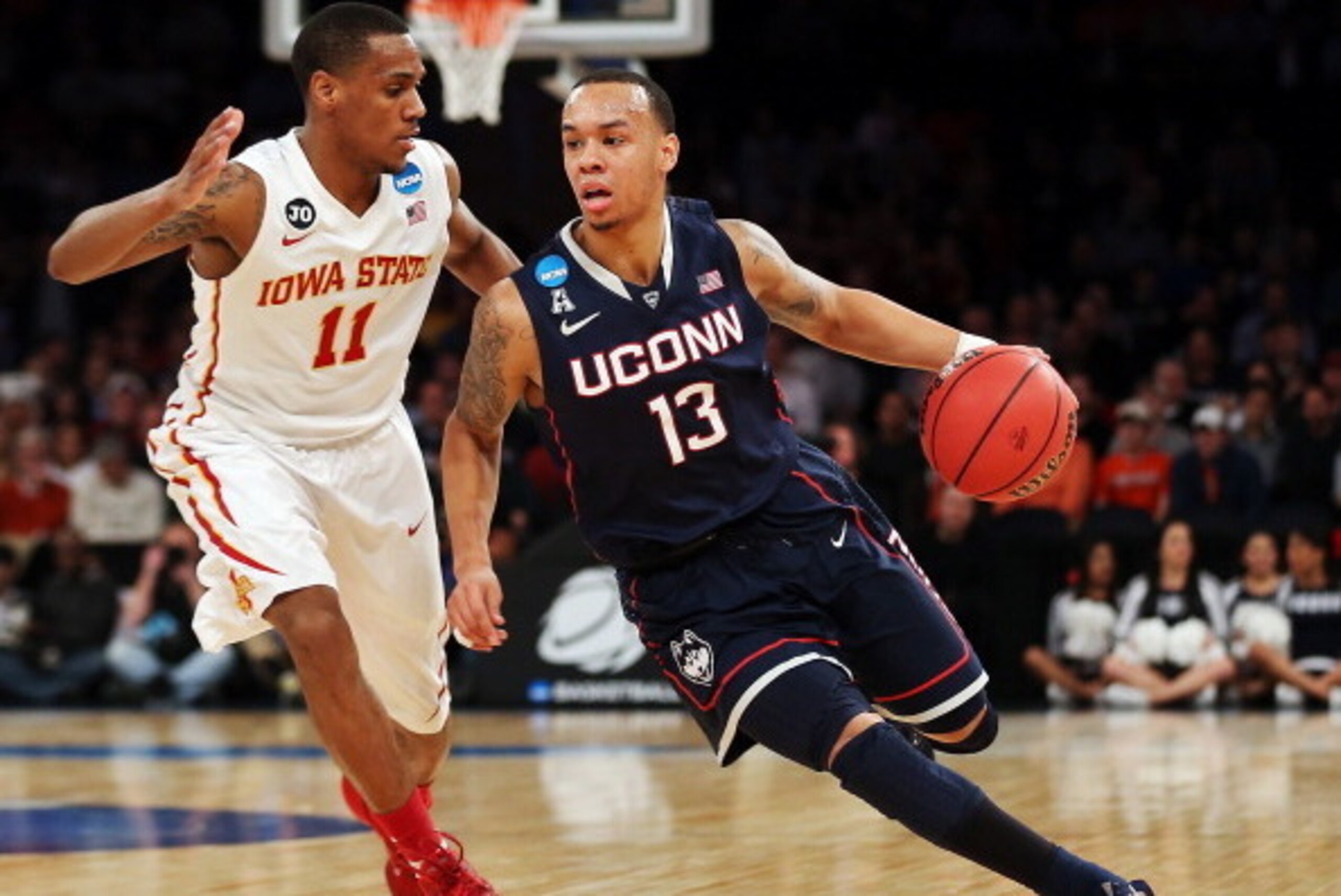 NEW YORK, NY - MARCH 28:  Shabazz Napier #13 of the Connecticut Huskies handles the ball against Monte Morris #11 of the Iowa State Cyclones during the regional semifinal of the 2014 NCAA Men's Basketball Tournament at Madison Square Garden on March 28, 2