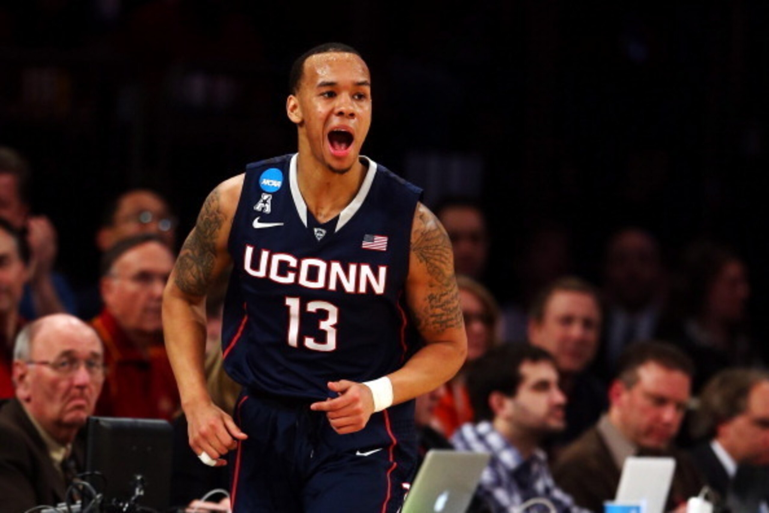 NEW YORK, NY - MARCH 28:  Shabazz Napier #13 of the Connecticut Huskies reacts after hitting a three pointer in the first half against the Iowa State Cyclones during the regional semifinal of the 2014 NCAA Men's Basketball Tournament at Madison Square Gar
