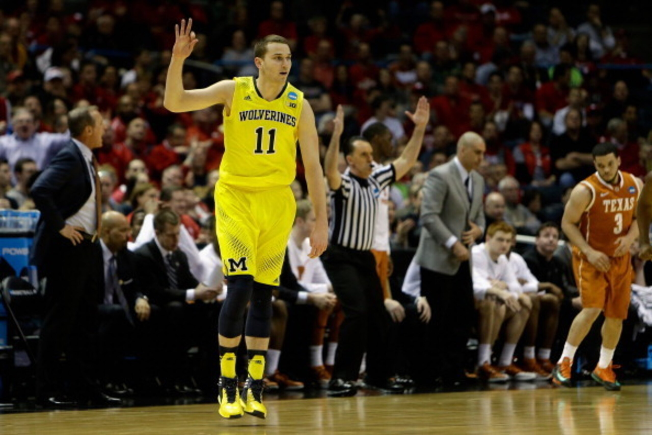 MILWAUKEE, WI - MARCH 22:  Nik Stauskas #11 of the Michigan Wolverines reacts in the first half against the Texas Longhorns during the third round of the 2014 NCAA Men's Basketball Tournament at BMO Harris Bradley Center on March 22, 2014 in Milwaukee, Wi