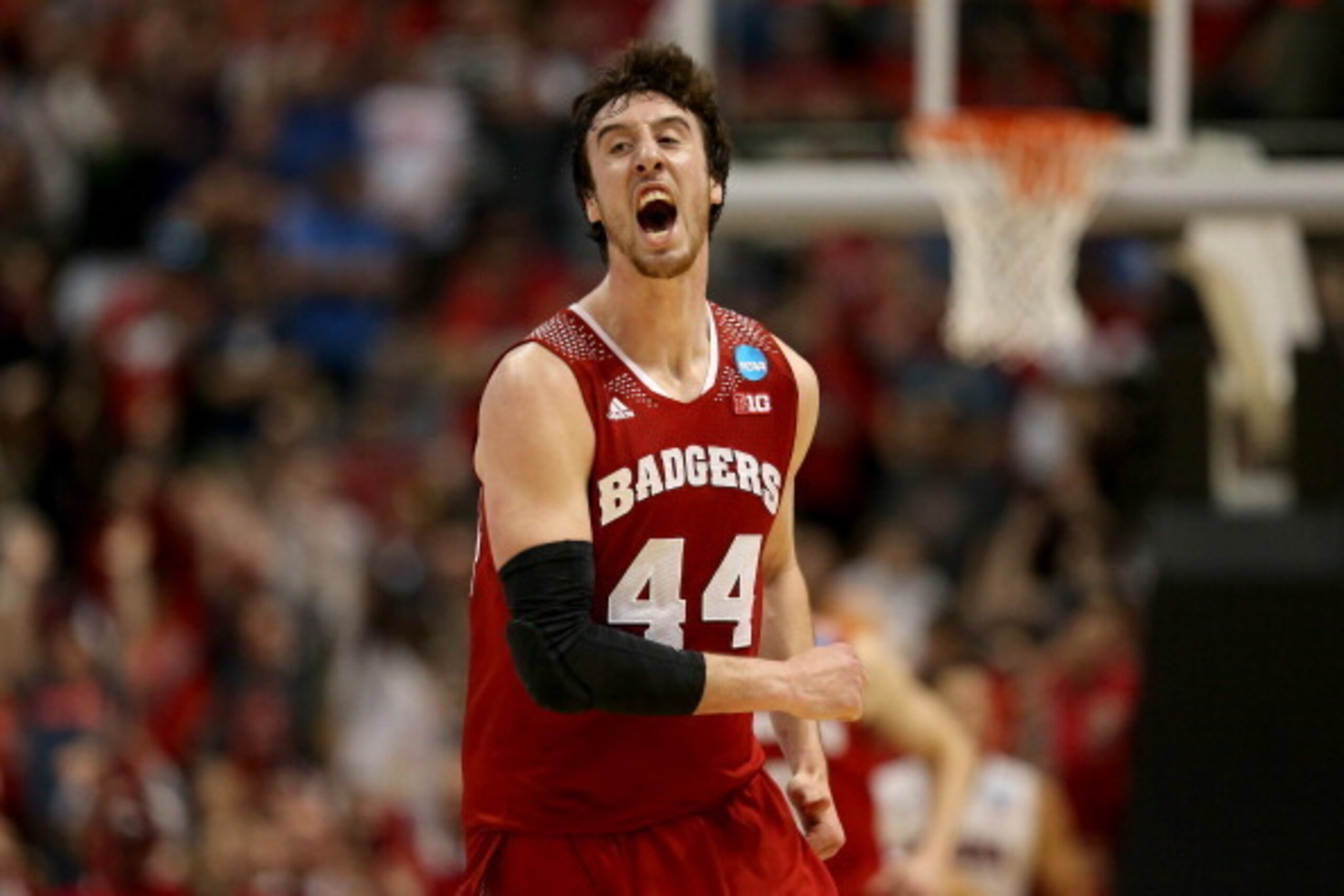 ANAHEIM, CA - MARCH 29:  Frank Kaminsky #44 of the Wisconsin Badgers celebrates after making a three-pointer in the second half while taking on the Arizona Wildcats during the West Regional Final of the 2014 NCAA Men's Basketball Tournament at the Honda C