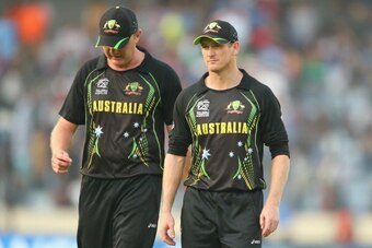 DHAKA, BANGLADESH - MARCH 23:  Doug Bollinger and George Bailey of Australia leave the field after the Pakistan innings during the ICC World Twenty20 Bangladesh 2014 match between Australia and Pakistan at Sher-e-Bangla Mirpur Stadium on March 23, 2014 in