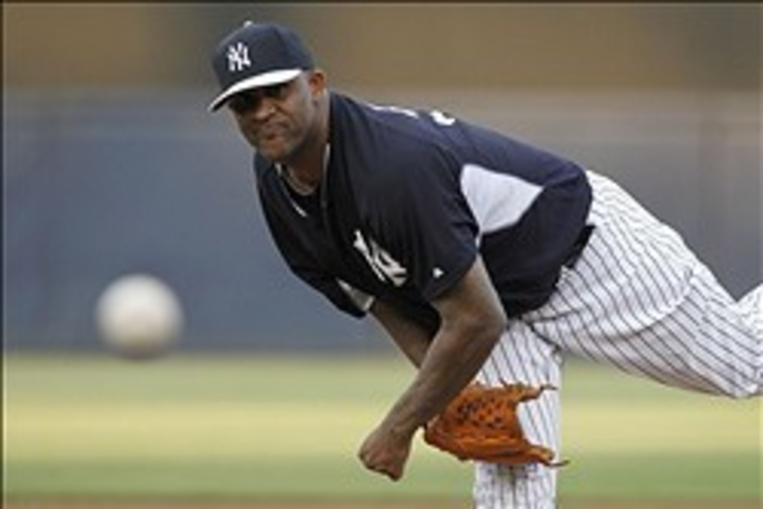 Mar 21, 2014; Tampa, FL, USA; New York Yankees starting pitcher CC Sabathia (52) throws a warm up pitch against the Pittsburgh Pirates at George M. Steinbrenner Field. Mandatory Credit: Kim Klement-USA TODAY Sports