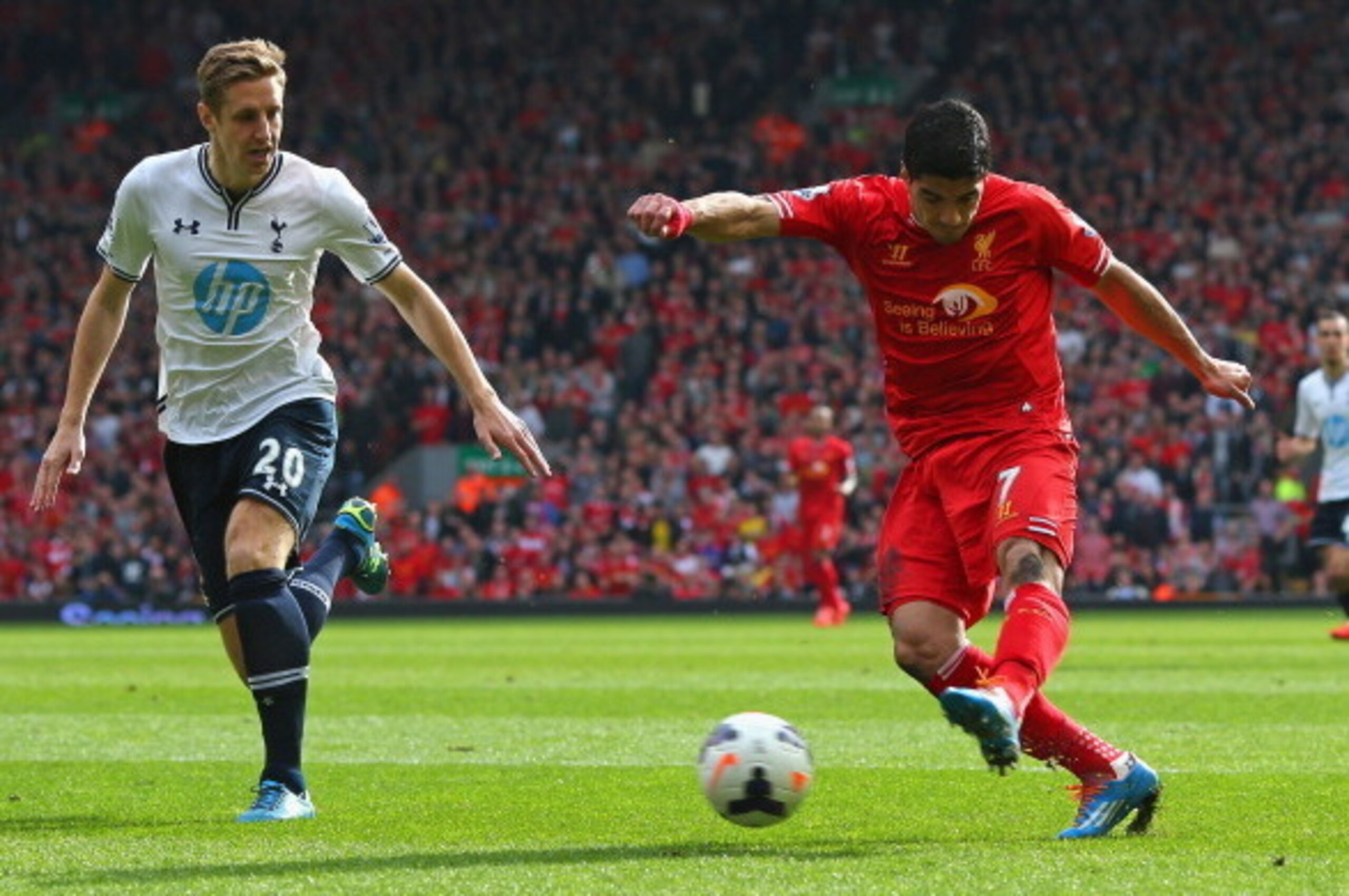 LIVERPOOL, ENGLAND - MARCH 30:  Luis Suarez of Liverpool scores the second goal during the Barclays Premier League match between Liverpool and Tottenham Hotspur at Anfield on March 30, 2014 in Liverpool, England.  (Photo by Alex Livesey/Getty Images)