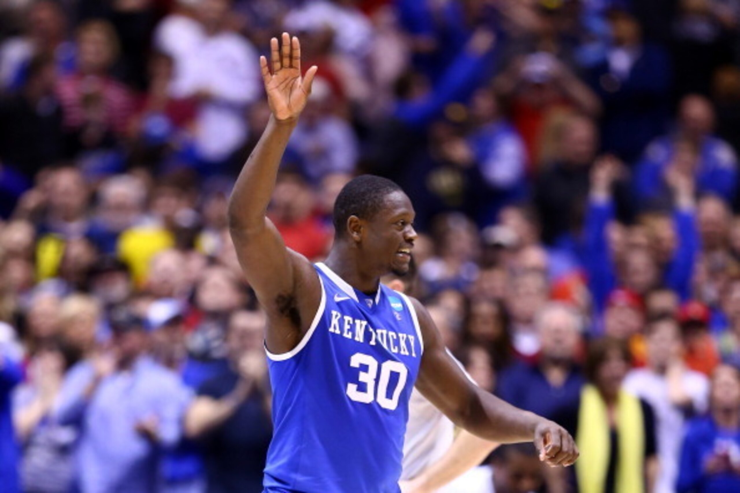 INDIANAPOLIS, IN - MARCH 28:  Julius Randle #30 of the Kentucky Wildcats celebrates defeating the Louisville Cardinals 74 to 69 during the regional semifinal of the 2014 NCAA Men's Basketball Tournament at Lucas Oil Stadium on March 28, 2014 in Indianapol