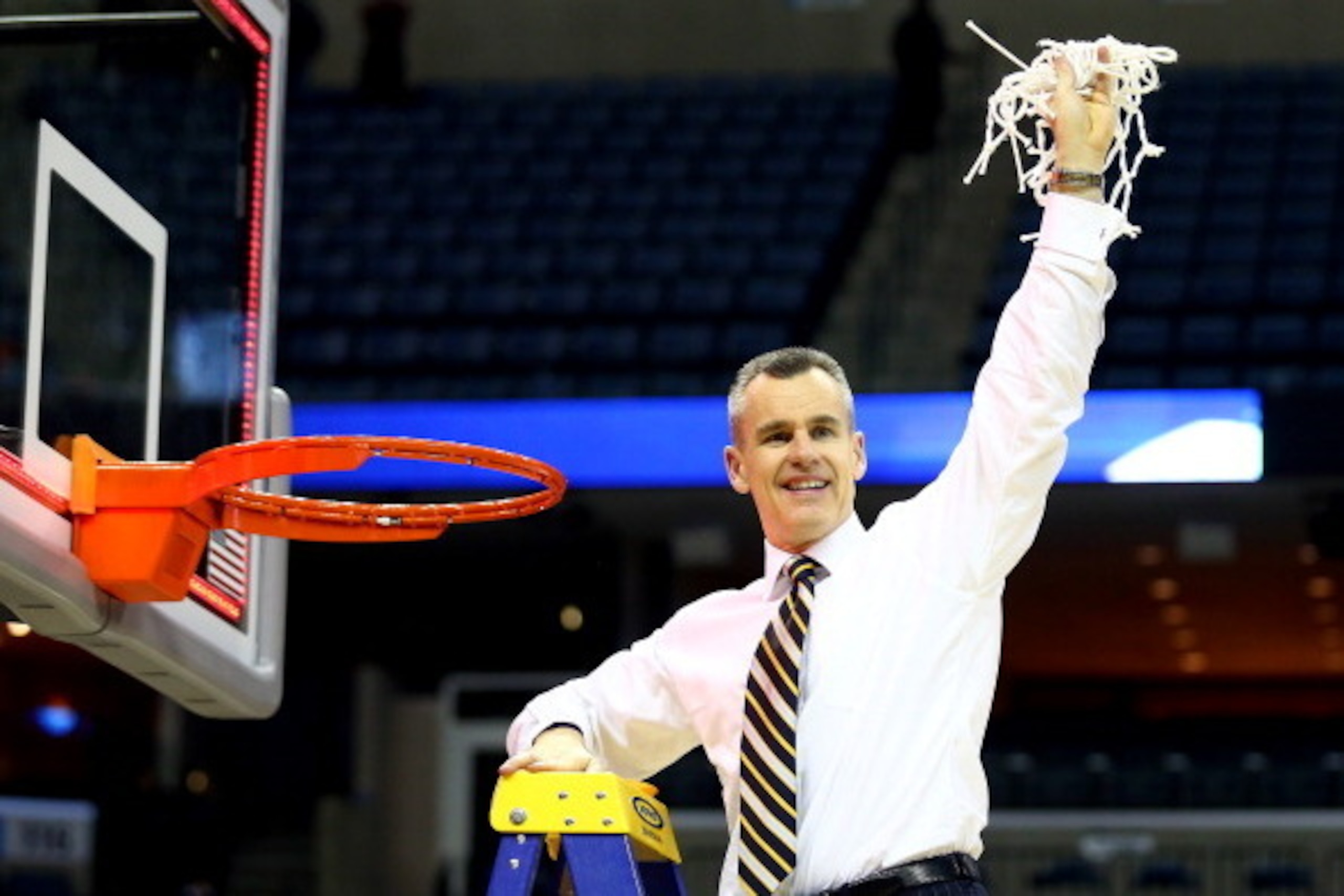 MEMPHIS, TN - MARCH 29:  Head coach Billy Donovan of the Florida Gators cuts the net after defeating the Dayton Flyers 62-52 in the south regional final of the 2014 NCAA Men's Basketball Tournament at the FedExForum on March 29, 2014 in Memphis, Tennessee