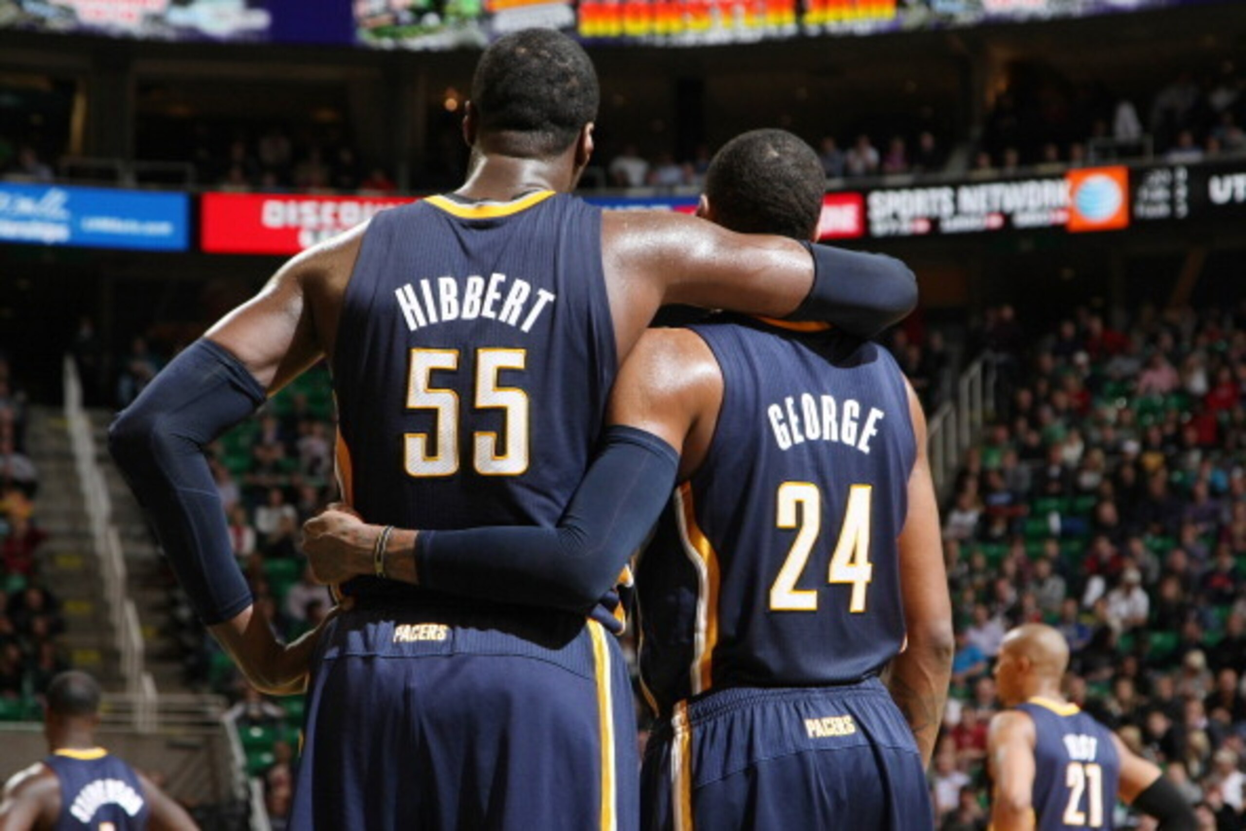 SALT LAKE CITY, UT - DECEMBER 04: Roy Hibbert #55 and Paul George #24 of the Indiana Pacers share a word during the game against the Utah Jazz at EnergySolutions Arena on December 04, 2013 in Salt Lake City, Utah. NOTE TO USER: User expressly acknowledges