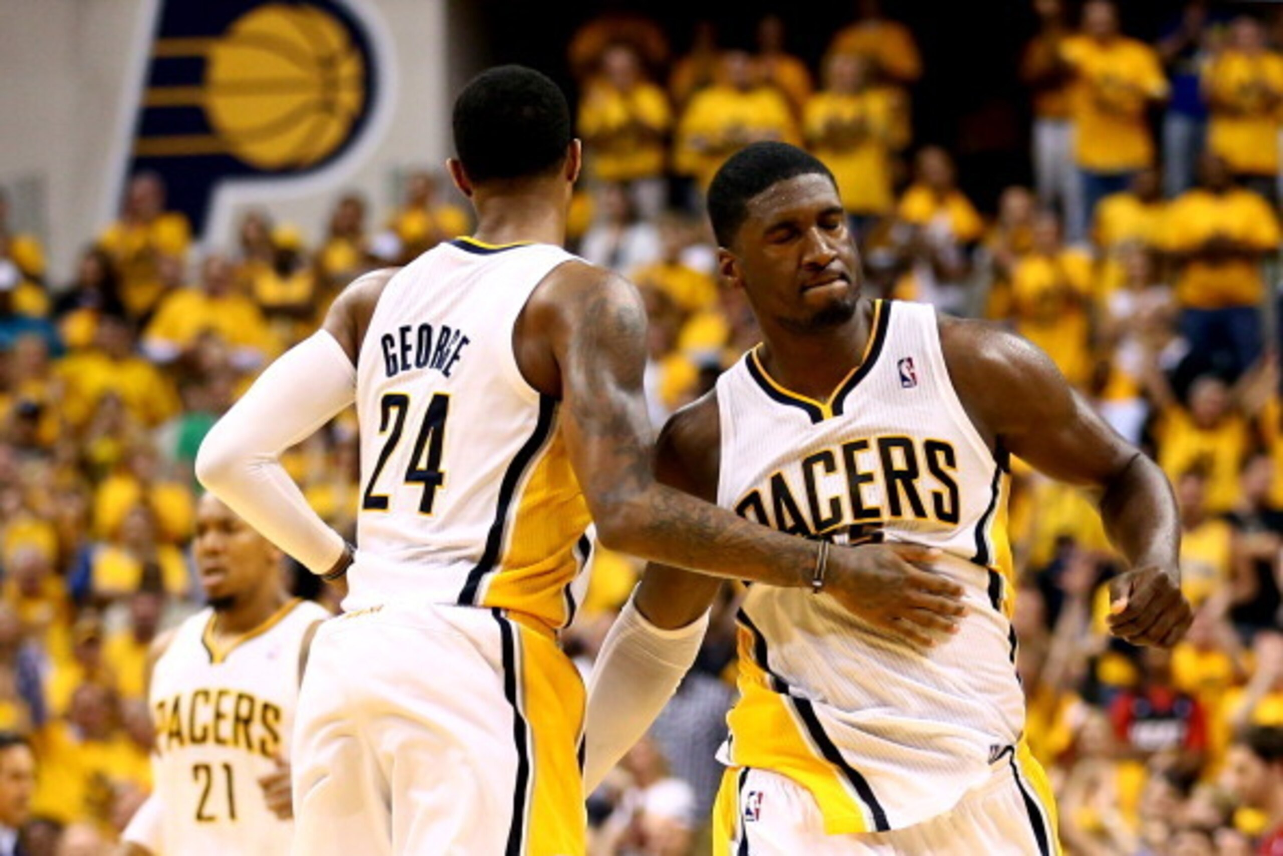INDIANAPOLIS, IN - JUNE 01:  Roy Hibbert #55 of the Indiana Pacers celebrates with teammate Paul George #24 after scoring against the Miami Heat in Game Six of the Eastern Conference Finals during the 2013 NBA Playoffs at Bankers Life Fieldhouse on June 1