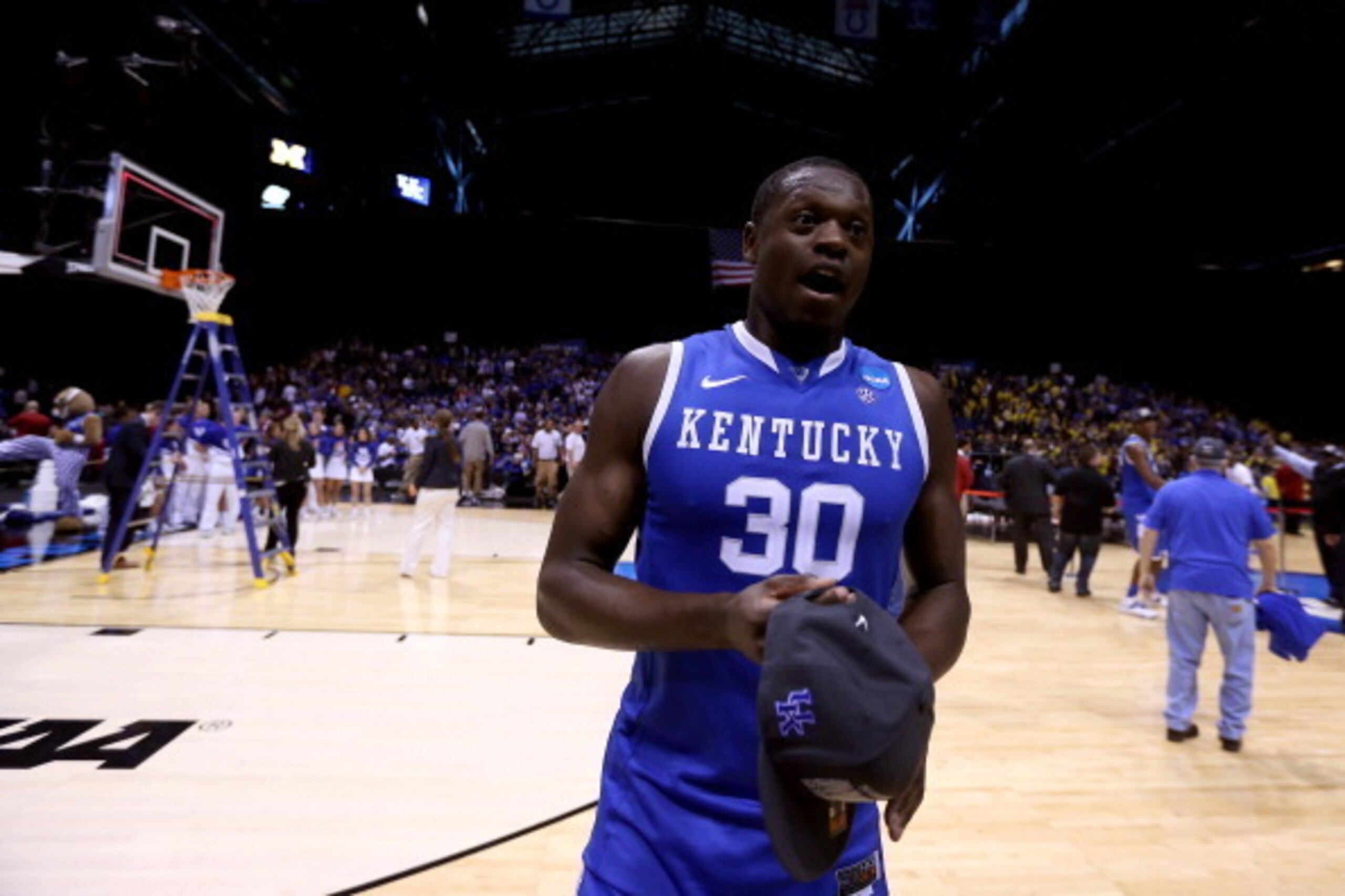 INDIANAPOLIS, IN - MARCH 30:  Julius Randle #30 of the Kentucky Wildcats celebrates after defeating the Michigan Wolverines 75 to 72 in the midwest regional final of the 2014 NCAA Men's Basketball Tournament at Lucas Oil Stadium on March 30, 2014 in India