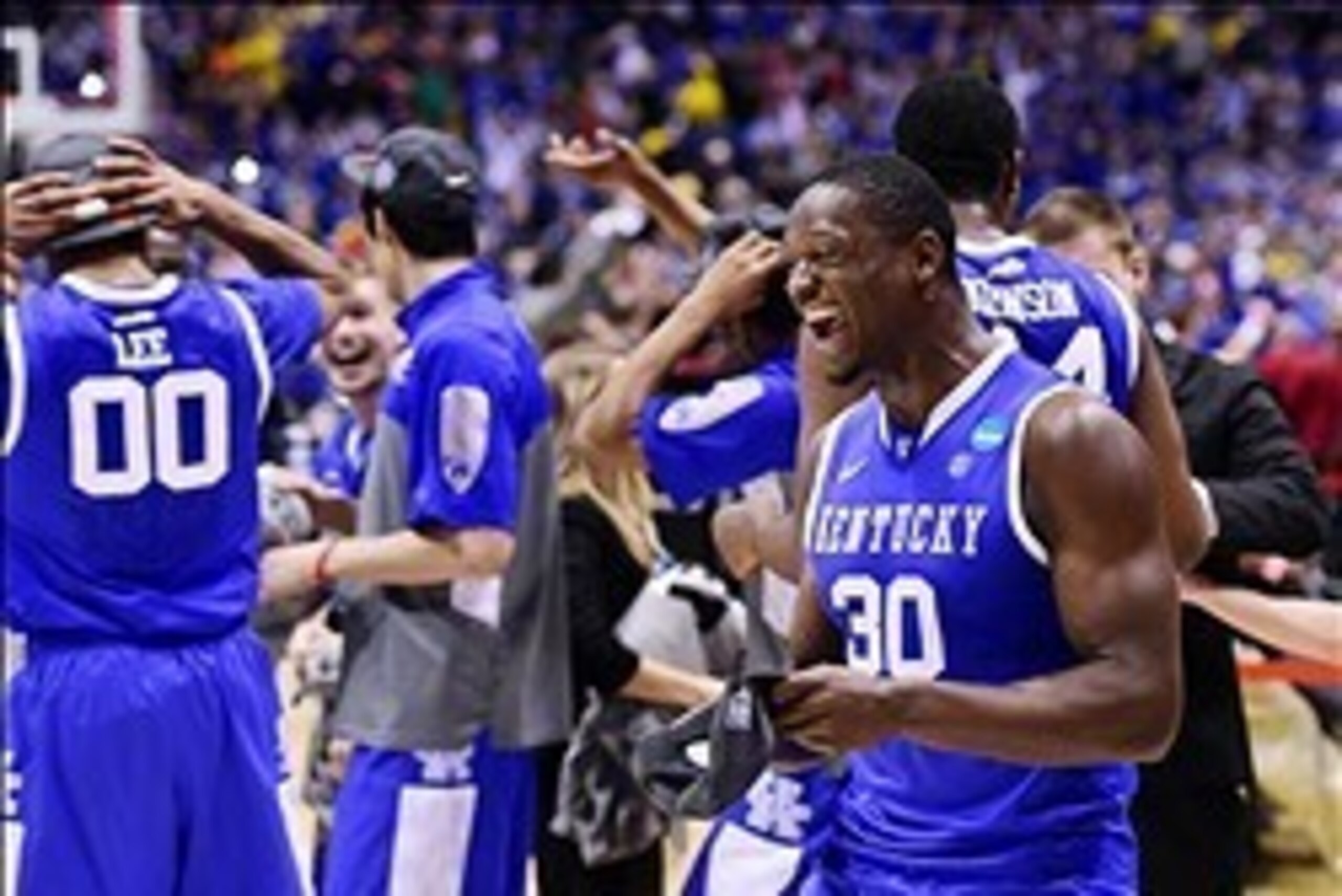 Mar 30, 2014; Indianapolis, IN, USA; Kentucky Wildcats forward Julius Randle (30) celebrates with teammates after defeating the Michigan Wolverines in the finals of the midwest regional of the 2014 NCAA Mens Basketball Championship tournament at Lucas Oil