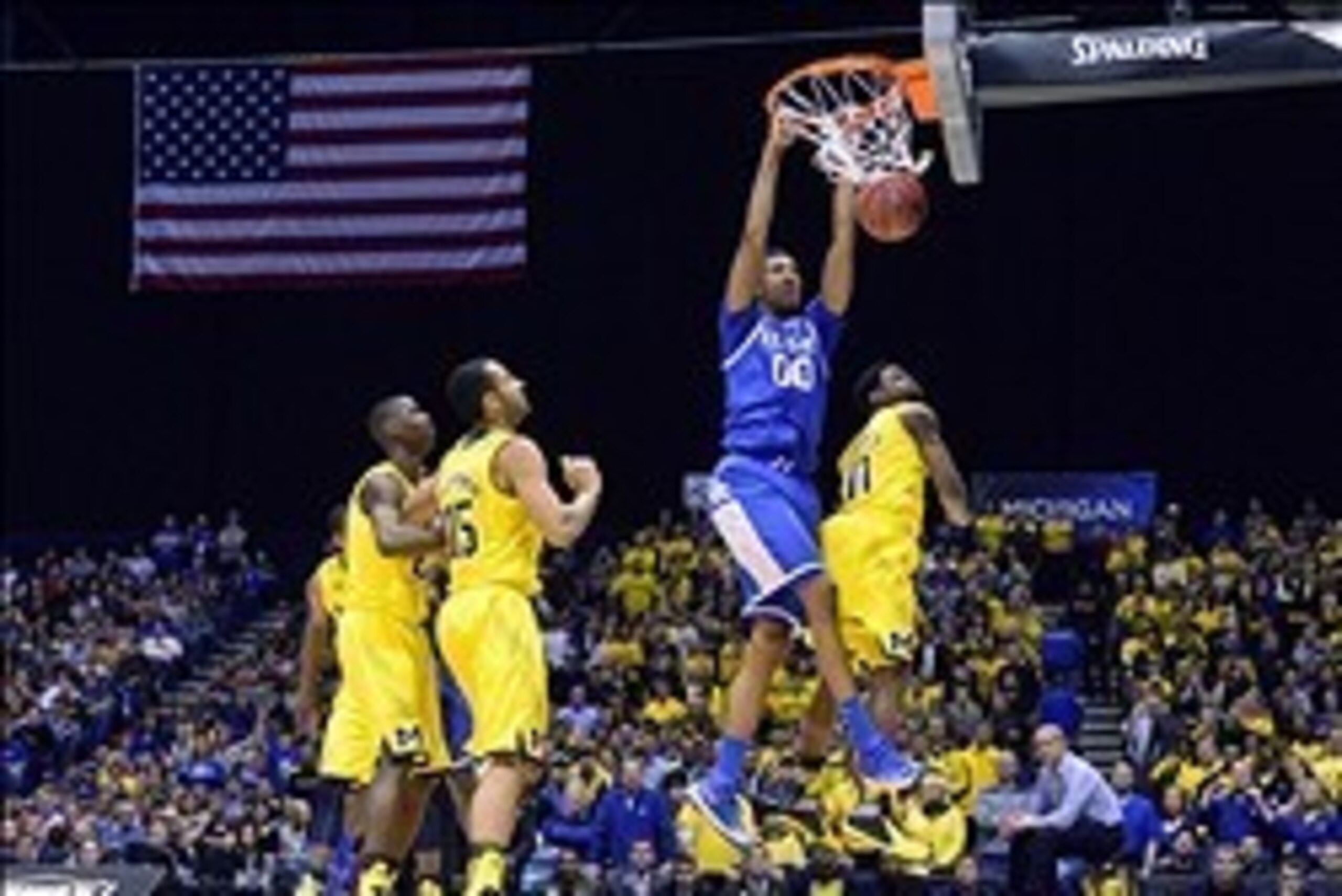 Mar 30, 2014; Indianapolis, IN, USA; Kentucky Wildcats forward Marcus Lee (0) dunks against the Michigan Wolverines in the first half of the finals of the midwest regional of the 2014 NCAA Mens Basketball Championship tournament at Lucas Oil Stadium. Mand