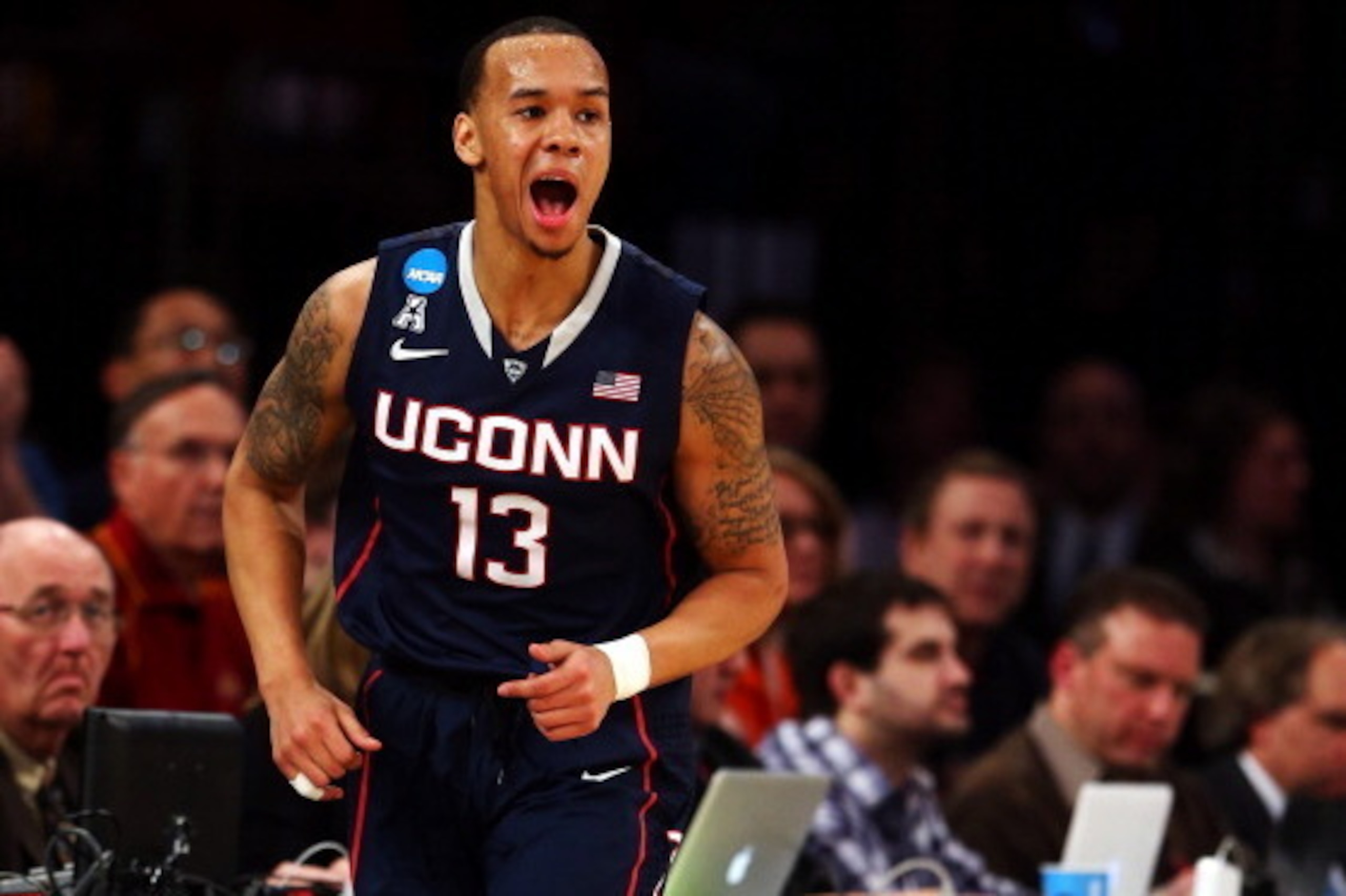 NEW YORK, NY - MARCH 28:  Shabazz Napier #13 of the Connecticut Huskies reacts after hitting a three pointer in the first half against the Iowa State Cyclones during the regional semifinal of the 2014 NCAA Men's Basketball Tournament at Madison Square Gar