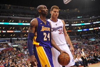 LOS ANGELES, CA - APRIL 7:  Kobe Bryant #24 of the Los Angeles Lakers and Blake Griffin #32 of the Los Angeles Clippers walk on court during the game between the Los Angeles Lakers and the Los Angeles Clippers at Staples Center on April 7, 2013 in Los Ang