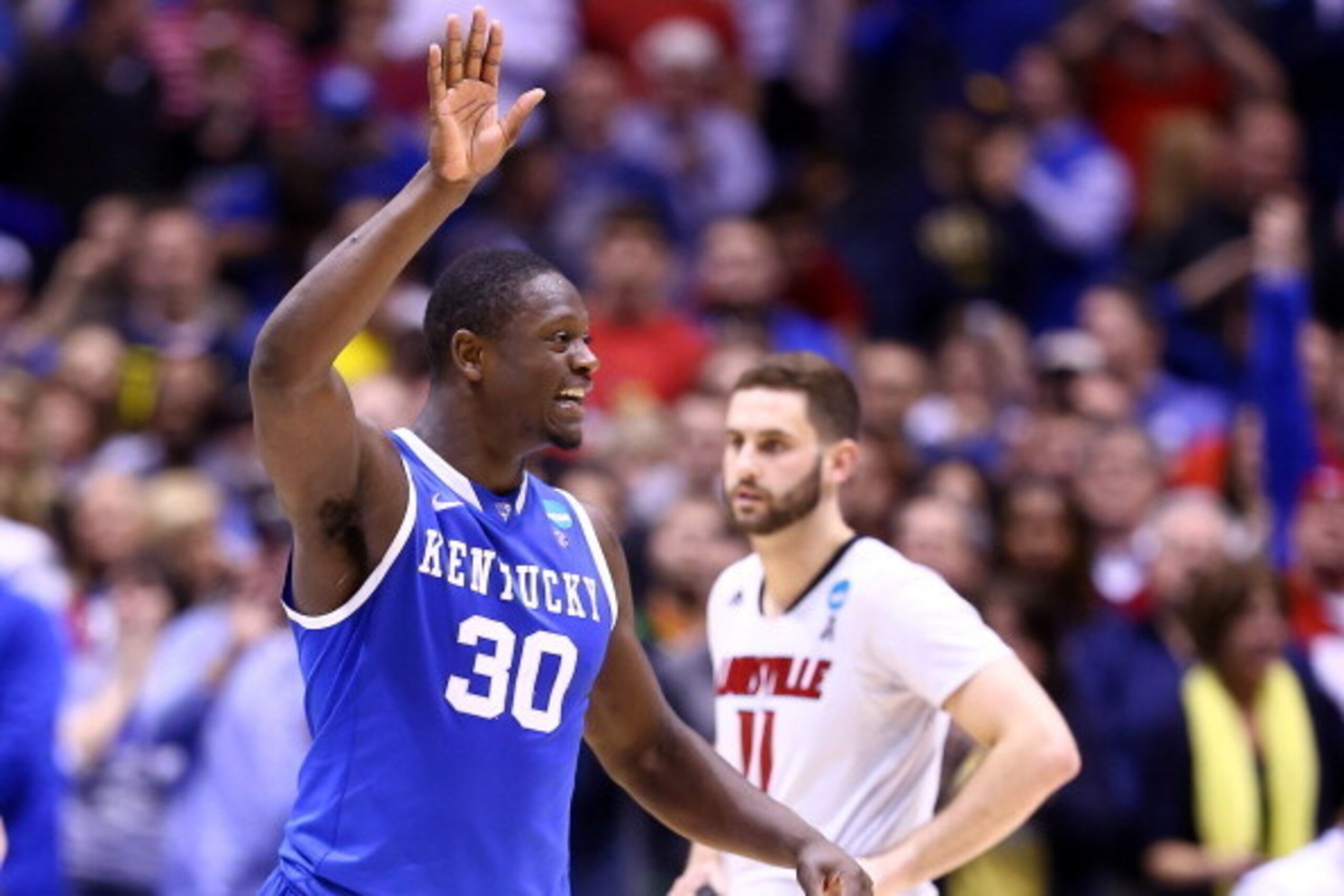 INDIANAPOLIS, IN - MARCH 28:  Julius Randle #30 of the Kentucky Wildcats celebrates defeating the Louisville Cardinals 74 to 69 during the regional semifinal of the 2014 NCAA Men's Basketball Tournament at Lucas Oil Stadium on March 28, 2014 in Indianapol