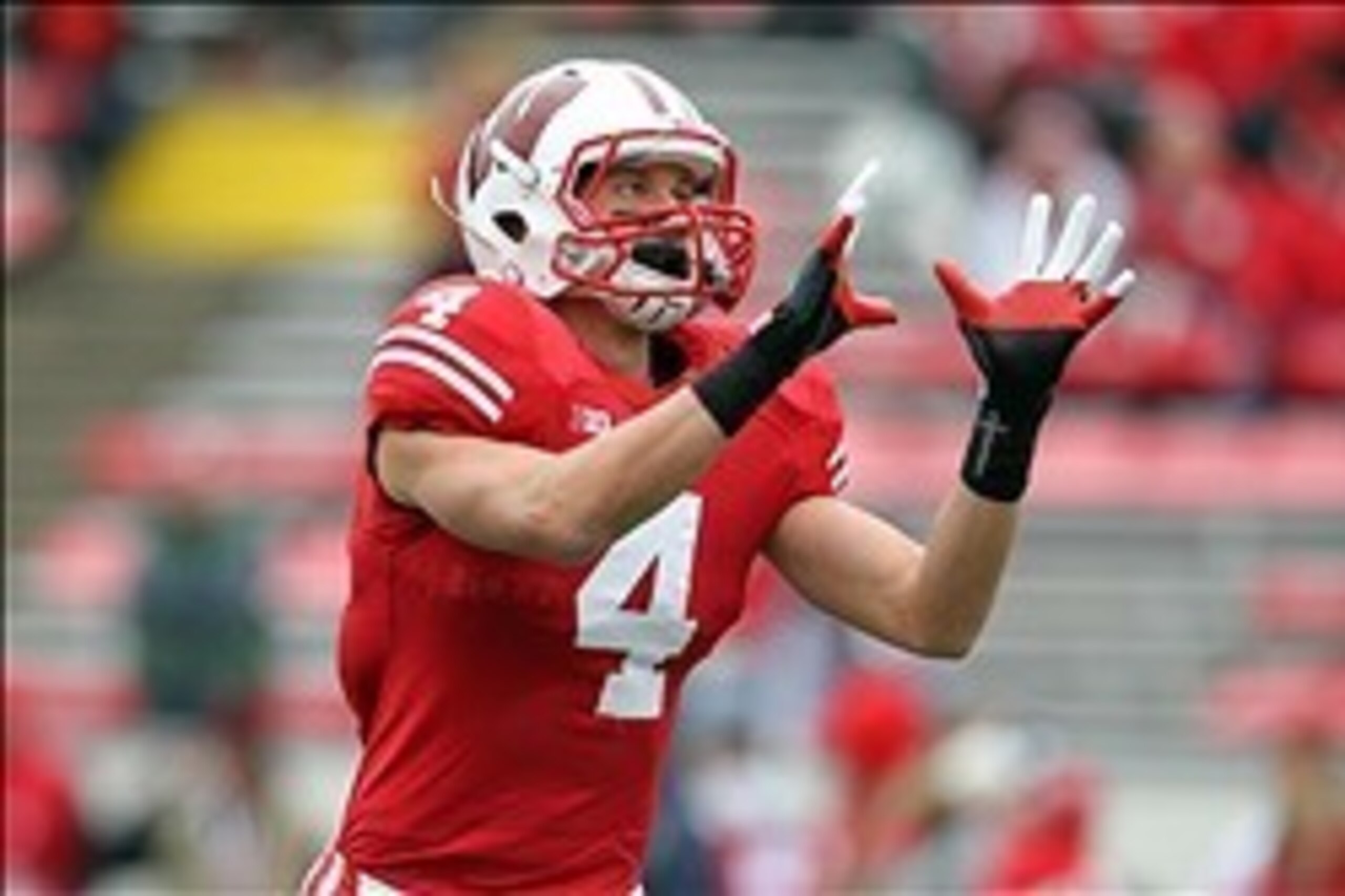 Oct 6, 2012; Madison, WI, USA; Wisconsin Badgers wide receiver Jared Abbrederis (4) catches a pass prior to the game against the Illinois Fighting Illini at Camp Randall Stadium. Mandatory Credit: Brace Hemmelgarn-USA TODAY Sports