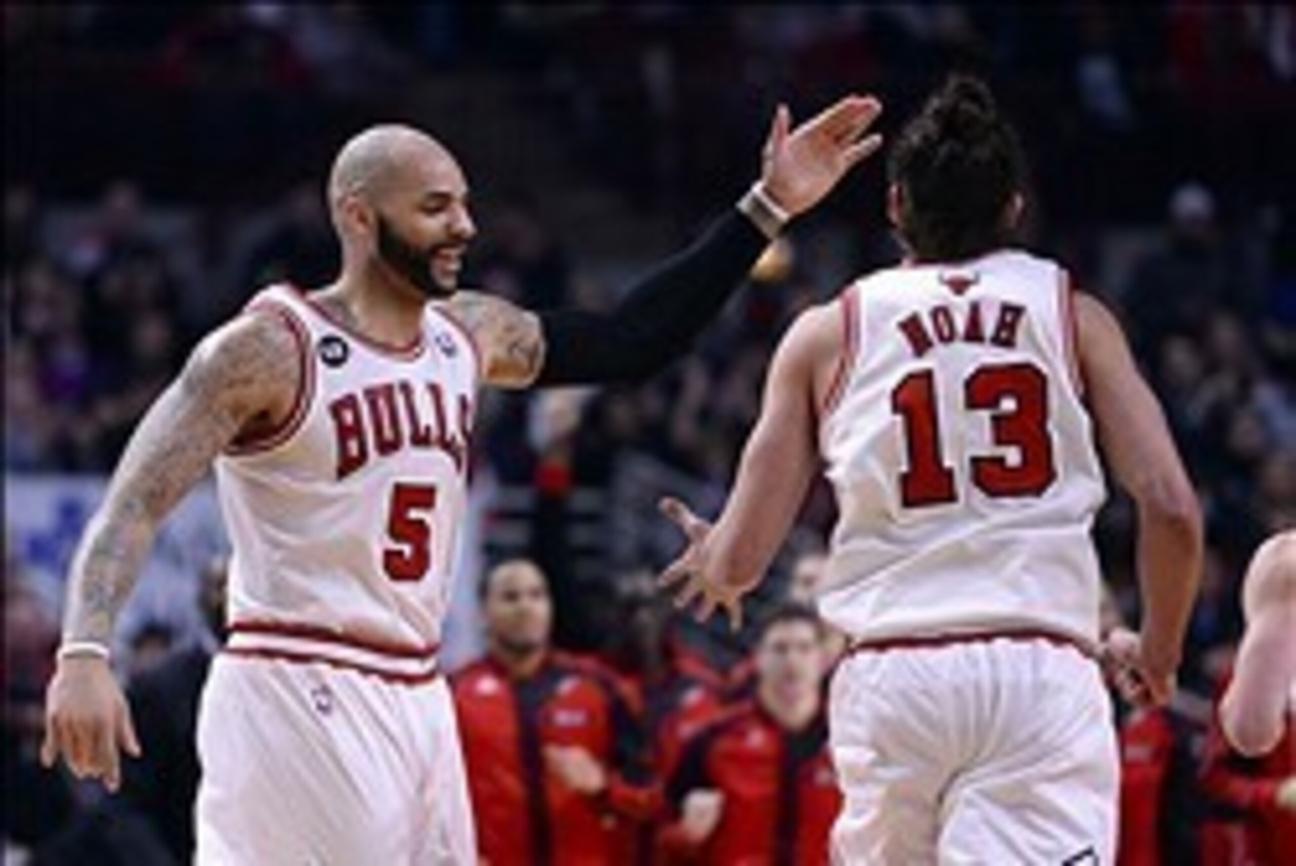 Mar 13, 2014; Chicago, IL, USA; Chicago Bulls forward Carlos Boozer (5) reacts with center Joakim Noah (13) during the second half at the United Center. Chicago defeats Houston 111-87. Mandatory Credit: Mike DiNovo-USA TODAY Sports Mar 13, 2014; Chicago, IL, USA; Chicago Bulls forward Carlos Boozer (5) reacts with center Joakim Noah (13) during the second half at the United Center. Chicago defeats Houston 111-87. Mandatory Credit: Mike DiNovo-USA TODAY Sports