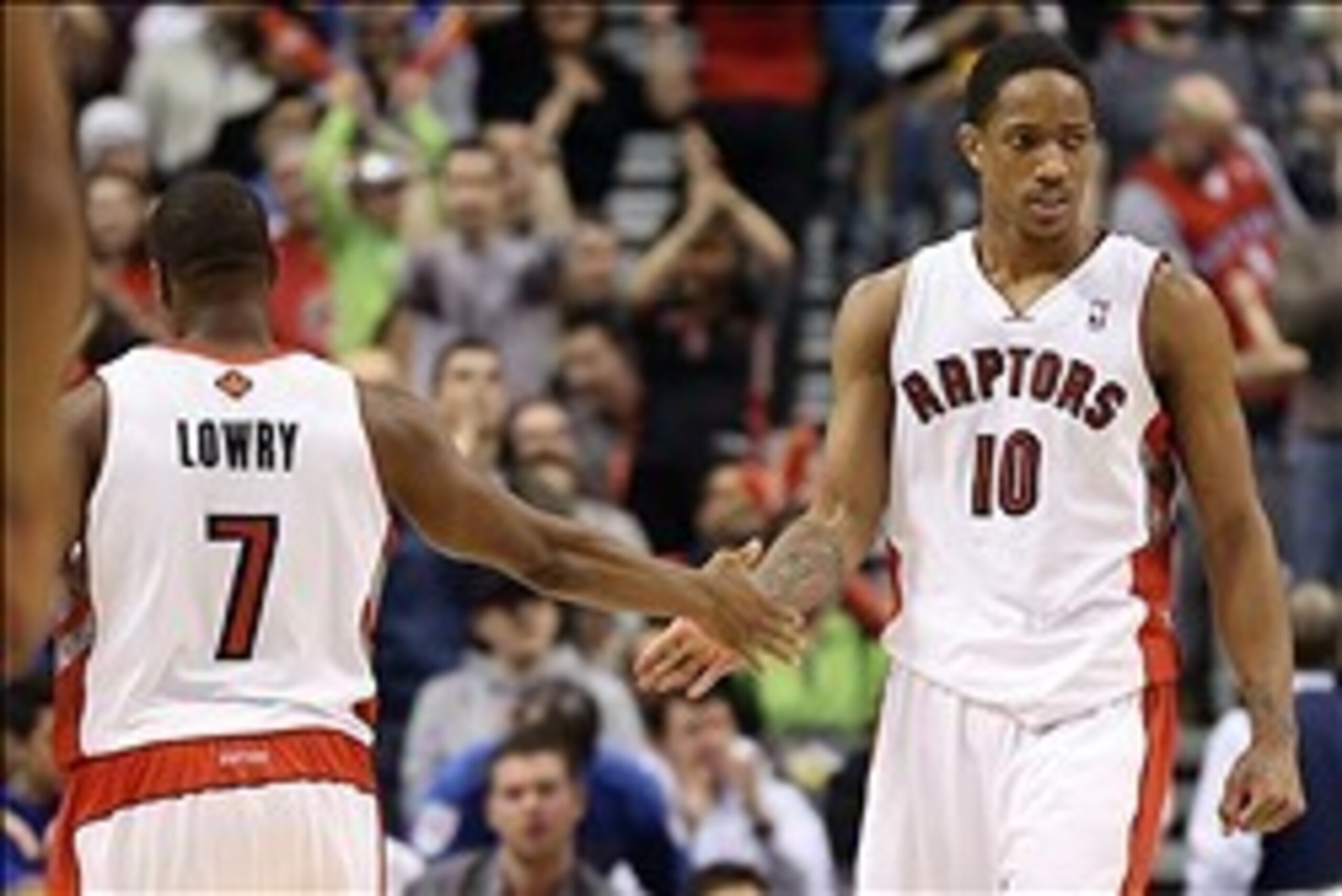 Mar 2, 2014; Toronto, Ontario, CAN; Toronto Raptors guard DeMar DeRozan (10) celebrates a basket with point guard Kyle Lowry (7) against the Golden State Warriors at Air Canada Centre. The Raptors beat the Warriors 104-98. Mandatory Credit: Tom Szczerbows Mar 2, 2014; Toronto, Ontario, CAN; Toronto Raptors guard DeMar DeRozan (10) celebrates a basket with point guard Kyle Lowry (7) against the Golden State Warriors at Air Canada Centre. The Raptors beat the Warriors 104-98. Mandatory Credit: Tom Szczerbows