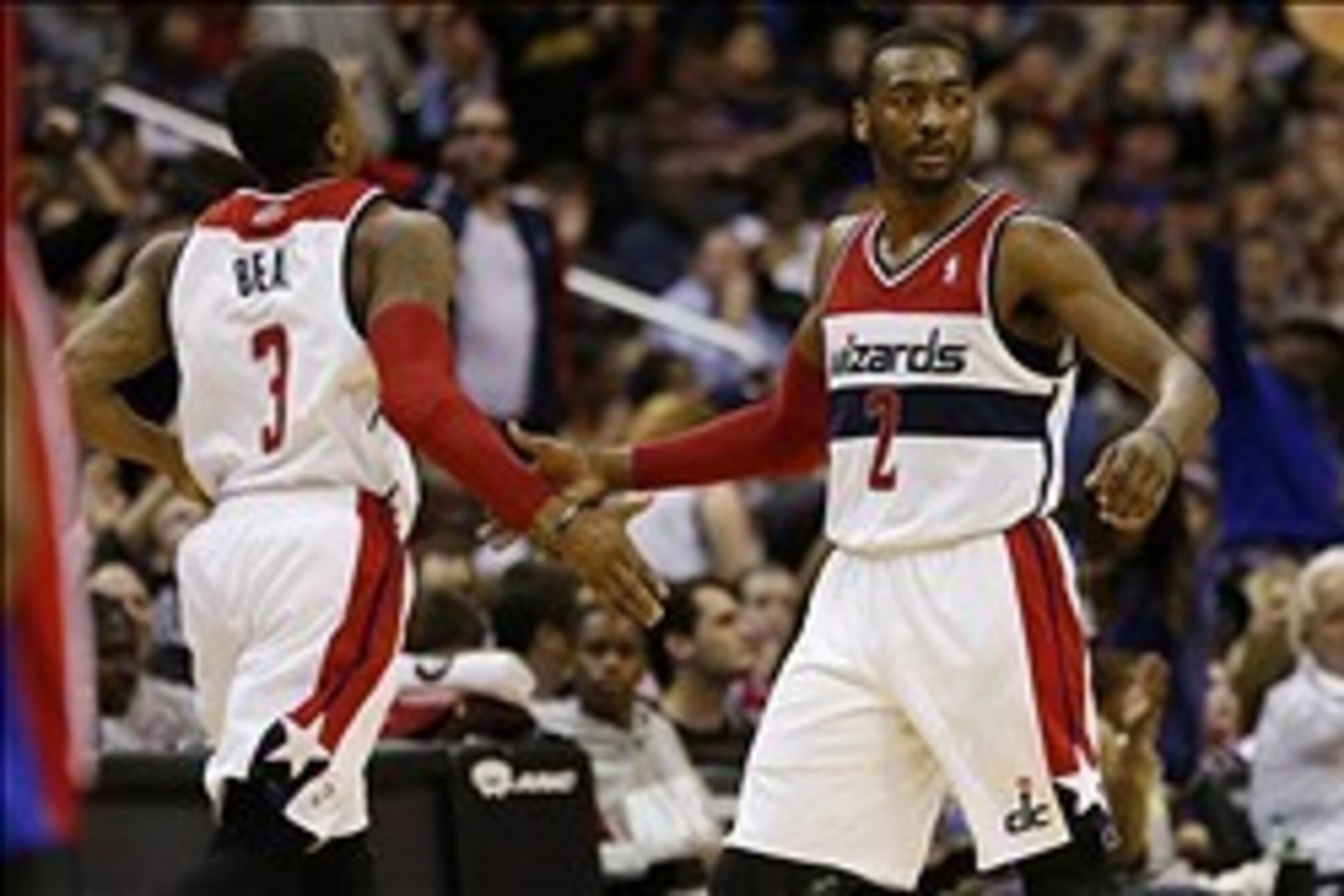 Dec 28, 2013; Washington, DC, USA; Washington Wizards point guard John Wall (2) celebrates with Wizards shooting guard Bradley Beal (3) against the Detroit Pistons in the second quarter at Verizon Center. The Wizards won 102-86. Mandatory Credit: Geoff Bu Dec 28, 2013; Washington, DC, USA; Washington Wizards point guard John Wall (2) celebrates with Wizards shooting guard Bradley Beal (3) against the Detroit Pistons in the second quarter at Verizon Center. The Wizards won 102-86. Mandatory Credit: Geoff Bu