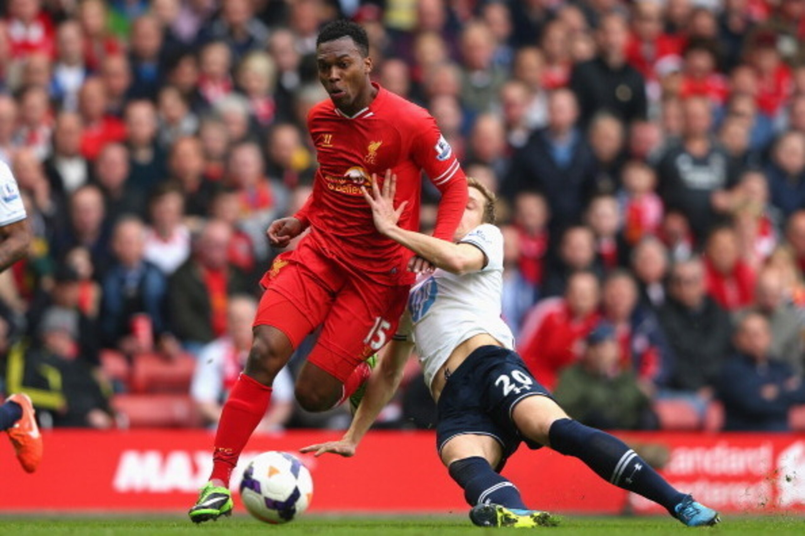 LIVERPOOL, ENGLAND - MARCH 30:  Daniel Sturridge of Liverpool is challenged by Michael Dawson of Tottenham Hotspur during the Barclays Premier League match between Liverpool and Tottenham Hotspur at Anfield on March 30, 2014 in Liverpool, England.  (Photo