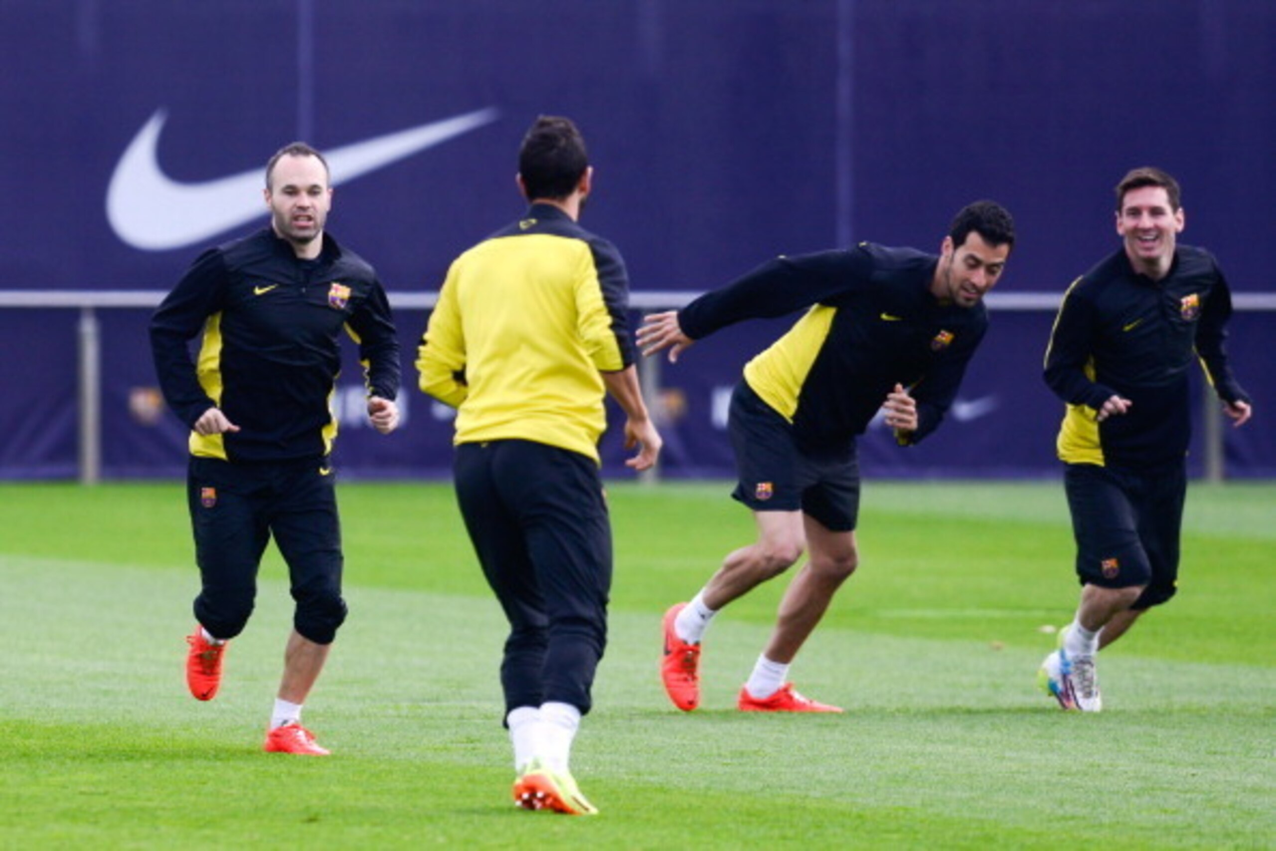 BARCELONA, SPAIN - MARCH 31: (L-R) Andres Iniesta, Sergio Busquets and Lionel Messi of FC Barcelona warm up during a training session ahead the UEFA Champions League Quarter Final first leg match against Atletico de Madrid at Sant Joan Despi Sport Complex