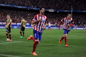 MADRID, SPAIN - MARCH 11:  Raul Garcia of  Club Atletico de Madrid celebrates after scoring Atletico's 3rd goal during the UEFA Champions League Round of 16, 2nd leg match between Club Atletico de Madrid v AC Milan at Vicente Calderon Stadium on March 11,