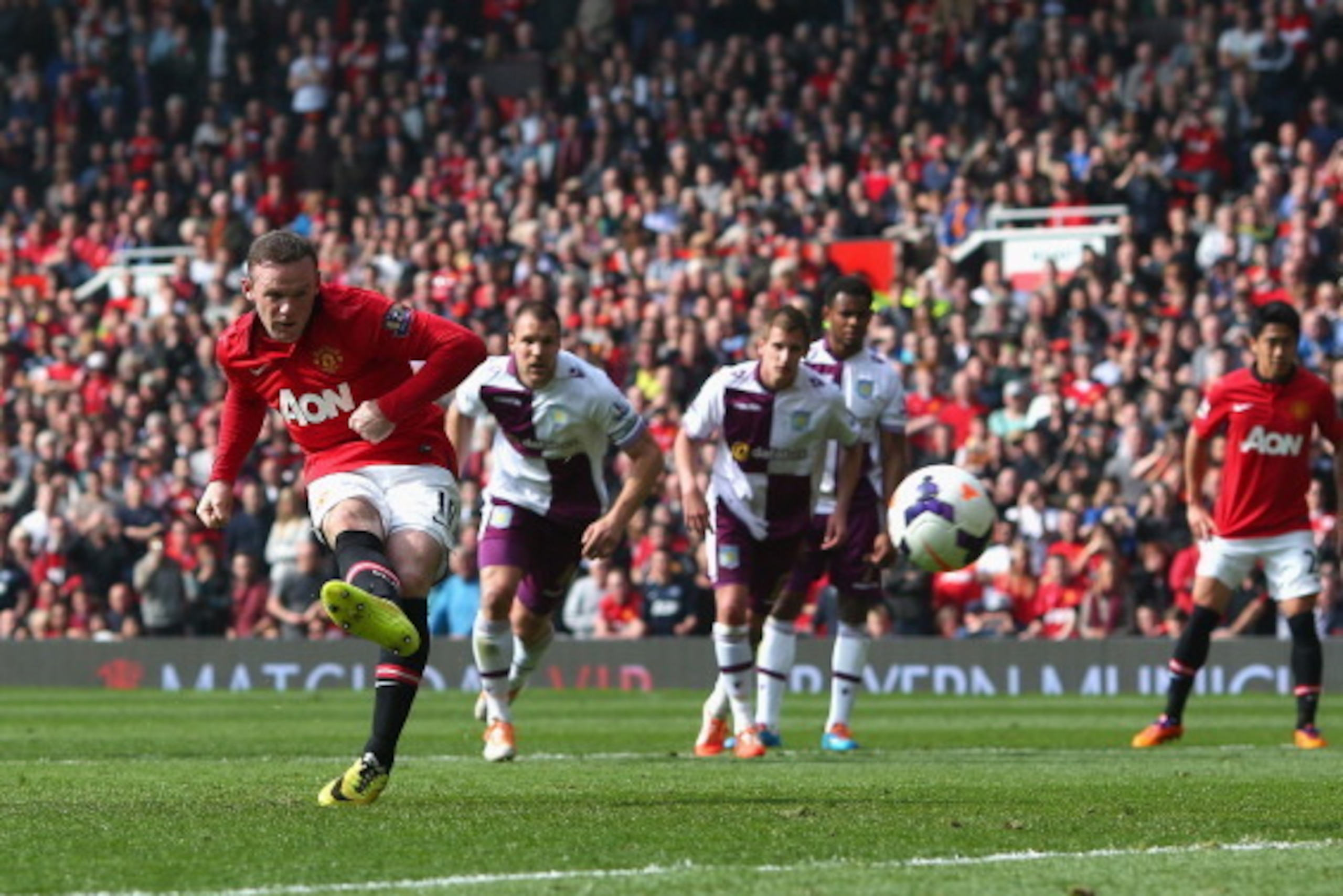 MANCHESTER, ENGLAND - MARCH 29:  Wayne Rooney of Manchester United scores his team's second goal from a penalty kick during the Barclays Premier League match between Manchester United and Aston Villa at Old Trafford on March 29, 2014 in Manchester, Englan
