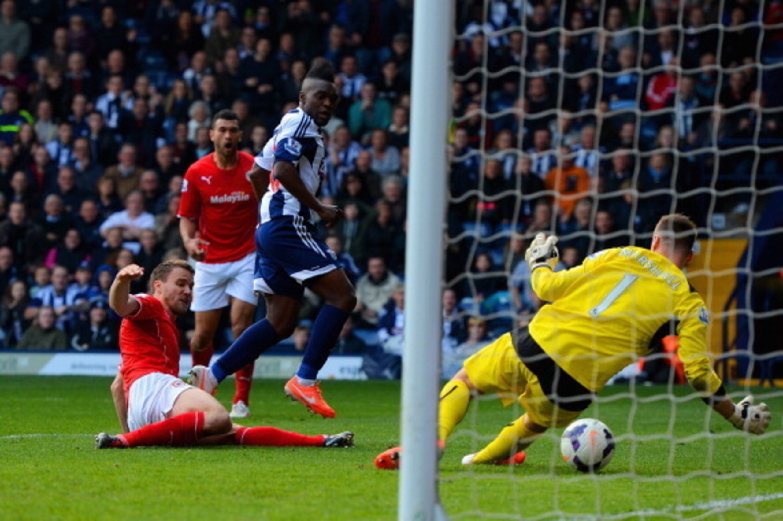 WEST BROMWICH, ENGLAND - MARCH 29:  Thievy Bifouma Koulossa of West Brom scores their third goal past David Marshall of Cardiff City during the Barclays Premier League match between West Bromwich Albion and Cardiff City at The Hawthorns on March 29, 2014 
