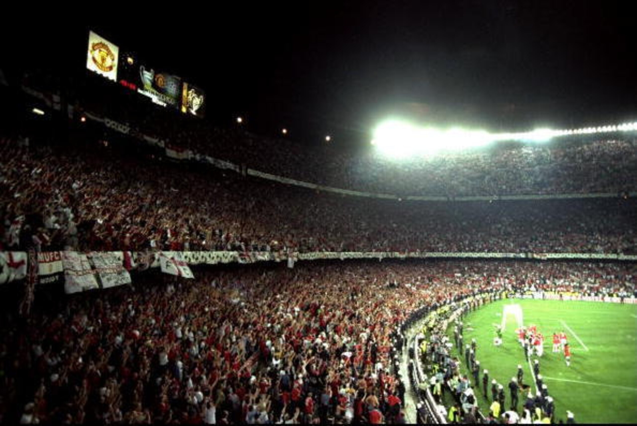 26 May 1999:  Manchester United fans celebrate victory in the European Champions League Final against Bayern Munich in the Nou Camp Stadium, Barcelona, Spain. Manchester United won 2 - 1 with both United goals scored during injury time, to secure the treb