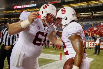 SEATTLE, WA - SEPTEMBER 28:  Running back Remound Wright #22 (R) of the Stanford Cardinal celebrates with Conor McFadden #61 after rushing for a touchdown in the fourth quarter against the Washington State Cougars on September 28, 2013 at CenturyLink Fiel
