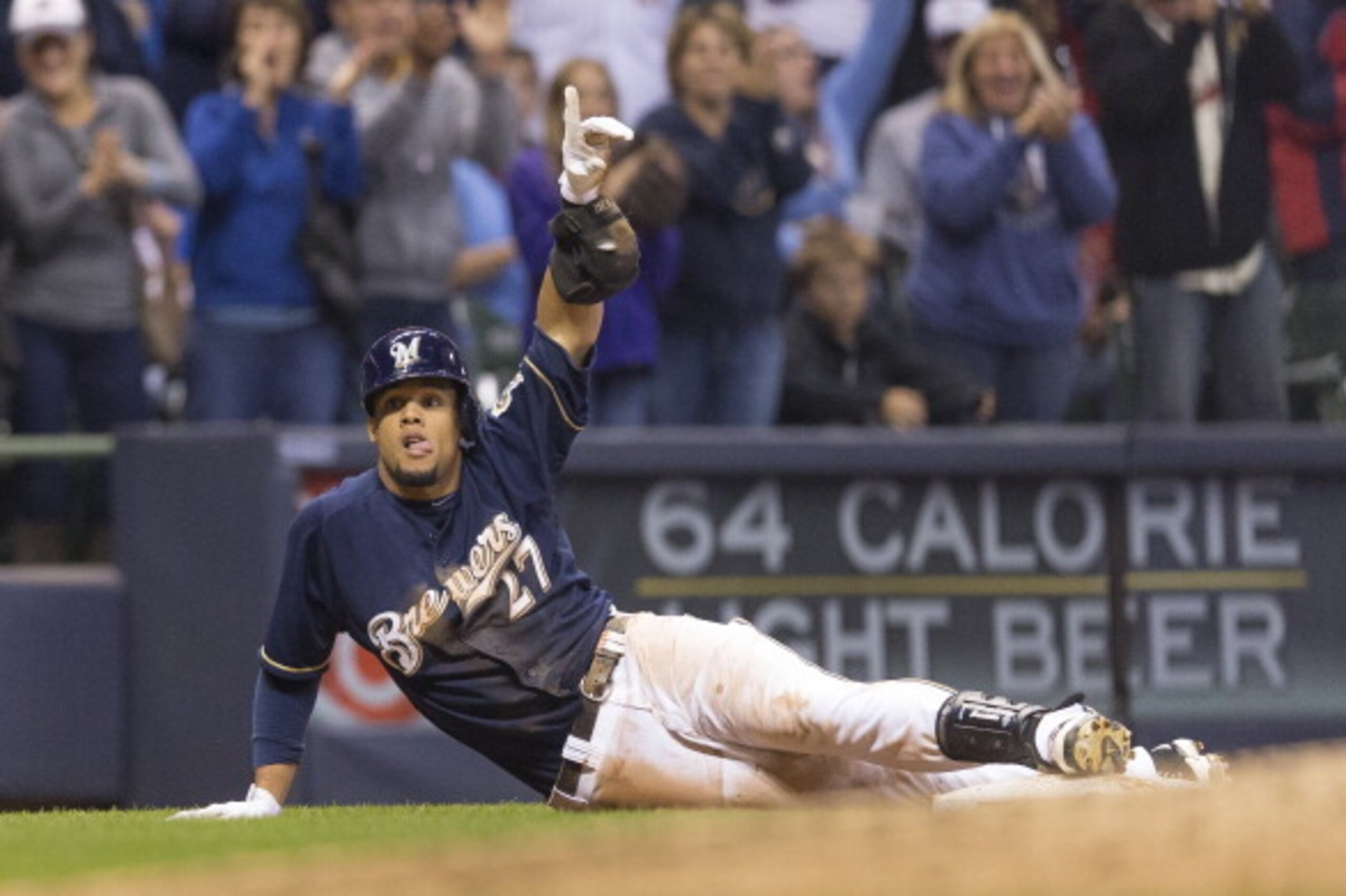 MILWAUKEE, WI - SEPTEMBER 22: Carlos Gomez #27 of the Milwaukee Brewers is in safely at third with a triple off of Joe Kelly #58 of the St. Louis Cardinals in the sixth inning at Miller Park on September 22, 2013 in Milwaukee, Wisconsin.  (Photo by Tom Ly