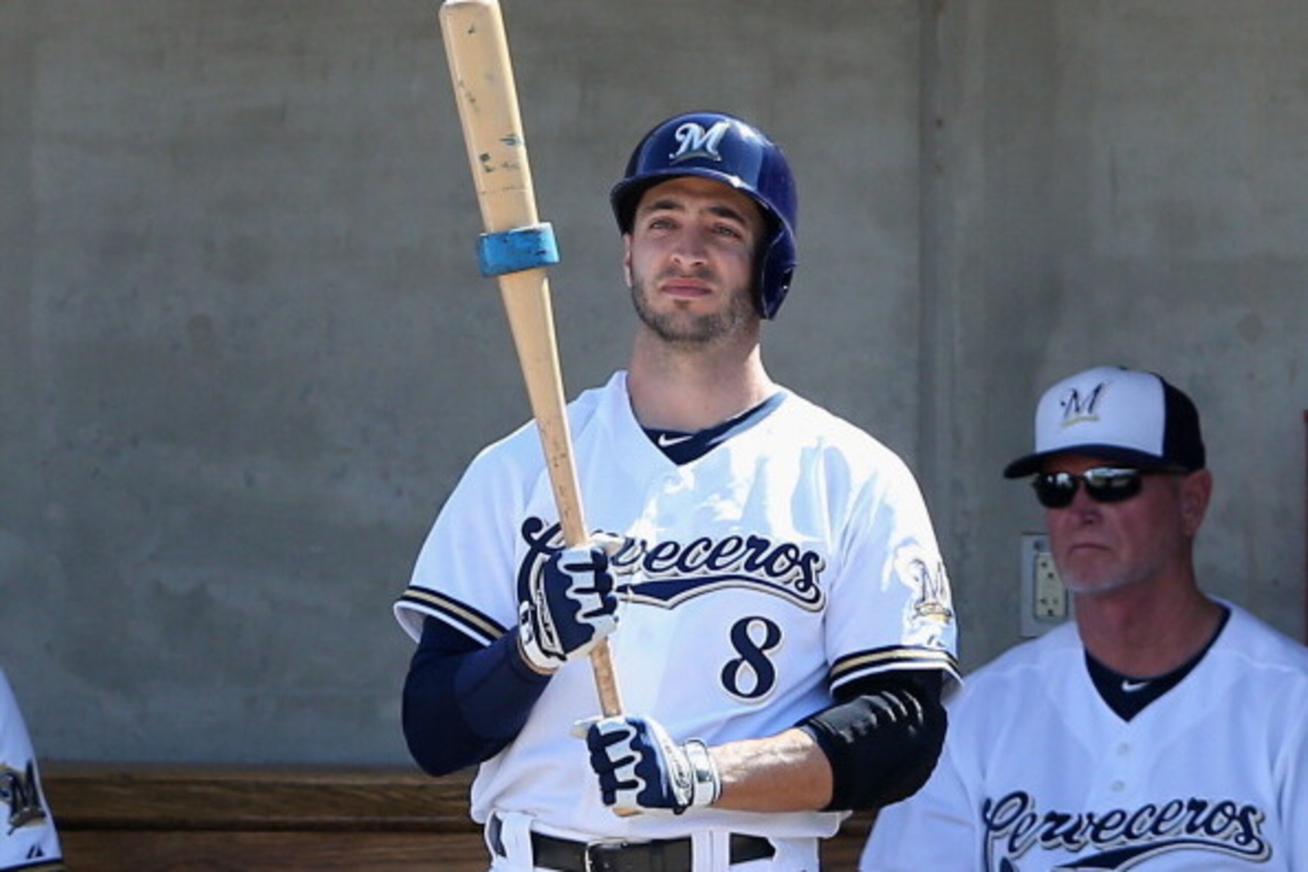 PHOENIX, AZ - MARCH 07:  Ryan Braun #8 of the Milwaukee Brewers waits to bat in the dugout during the spring training game against the San Diego Padres at Maryvale Baseball Park on March 7, 2014 in Phoenix, Arizona.  (Photo by Christian Petersen/Getty Ima