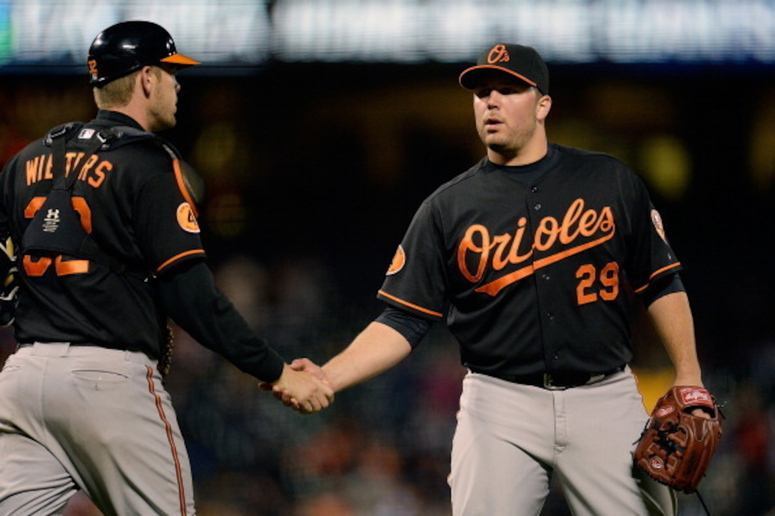 SAN FRANCISCO, CA - AUGUST 09: Catcher Matt Wieters #32 and pitcher Tommy Hunter #29 shake hands after a 5-2 win over the San Francisco Giants in 10 innings at AT&T Park on August 9, 2013 in San Francisco, California. (Photo by Thearon W. Henderson/Gett SAN FRANCISCO, CA - AUGUST 09: Catcher Matt Wieters #32 and pitcher Tommy Hunter #29 shake hands after a 5-2 win over the San Francisco Giants in 10 innings at AT&T Park on August 9, 2013 in San Francisco, California. (Photo by Thearon W. Henderson/Gett