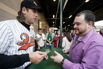 Rocker signs for a fan in 2005, during his stint with the Long Island Ducks.