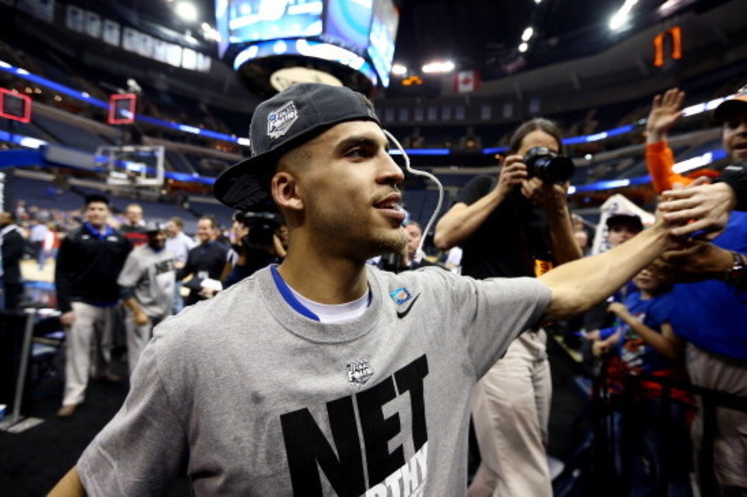 MEMPHIS, TN - MARCH 29:  Scottie Wilbekin #5 of the Florida Gators celebrates with fans after defeating the Dayton Flyers 62-52 in the south regional final of the 2014 NCAA Men's Basketball Tournament at the FedExForum on March 29, 2014 in Memphis, Tennes