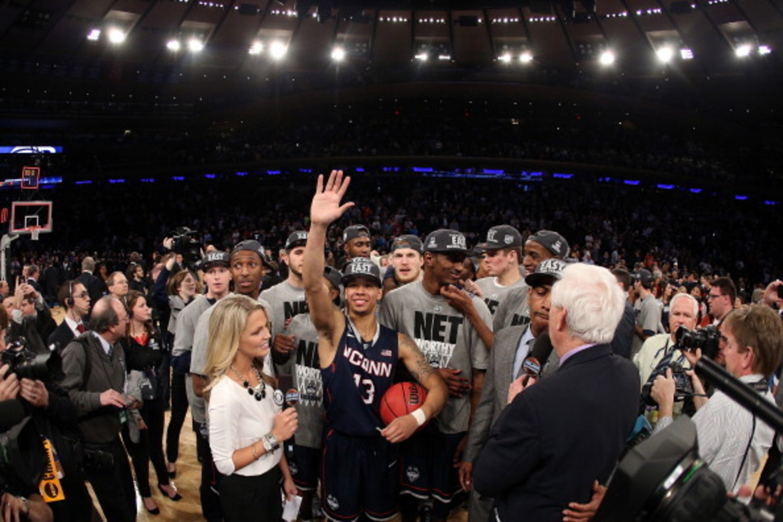 NEW YORK, NY - MARCH 30:  Shabazz Napier #13 of the Connecticut Huskies celebrates with his team after defeating the Michigan State Spartans to win the East Regional Final of the 2014 NCAA Men's Basketball Tournament at Madison Square Garden on March 30, 