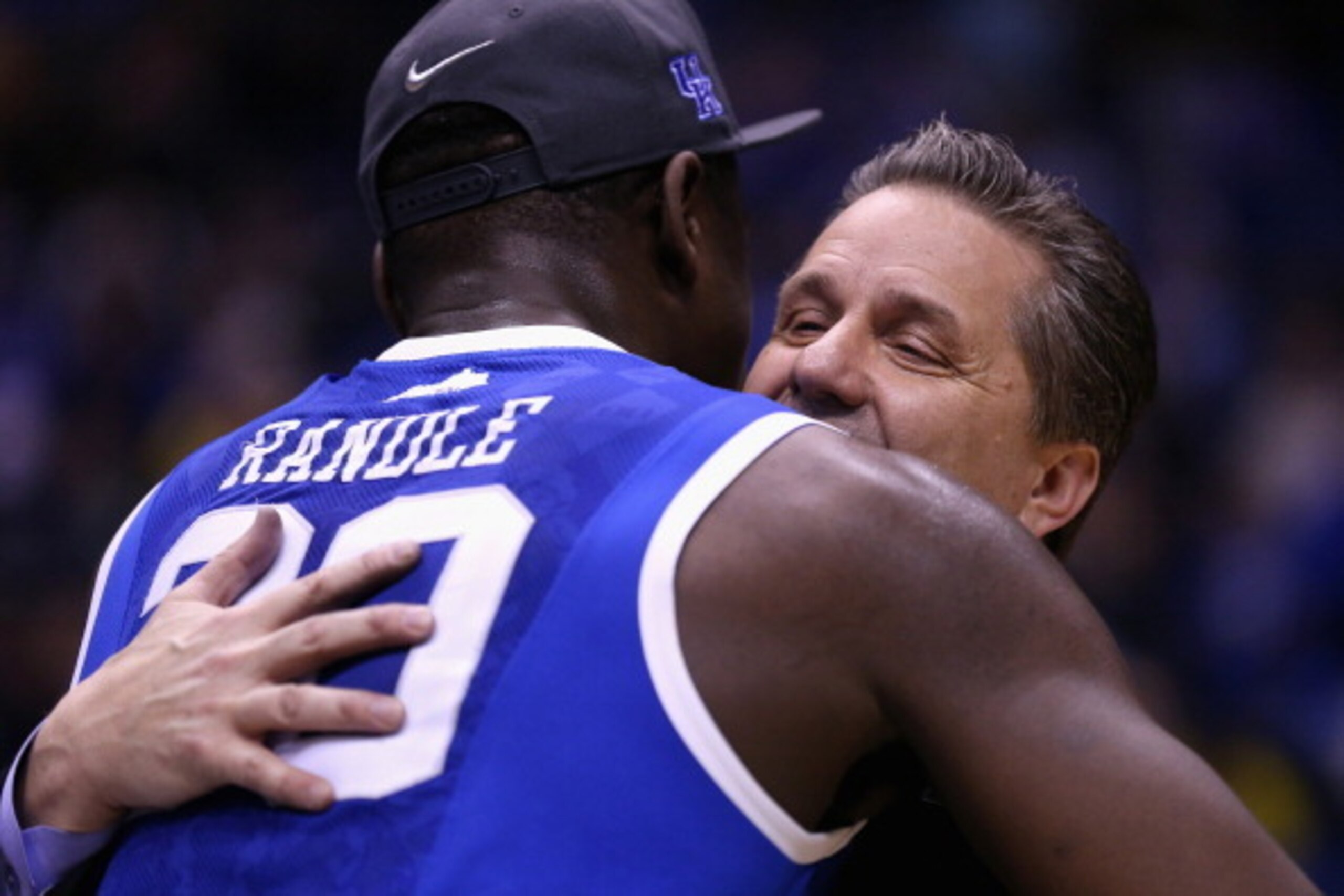 INDIANAPOLIS, IN - MARCH 30:  head coach John Calipari of the Kentucky Wildcats celebrates with Julius Randle #30 after defeating the Michigan Wolverines 75 to 72 in the midwest regional final of the 2014 NCAA Men's Basketball Tournament at Lucas Oil Stad
