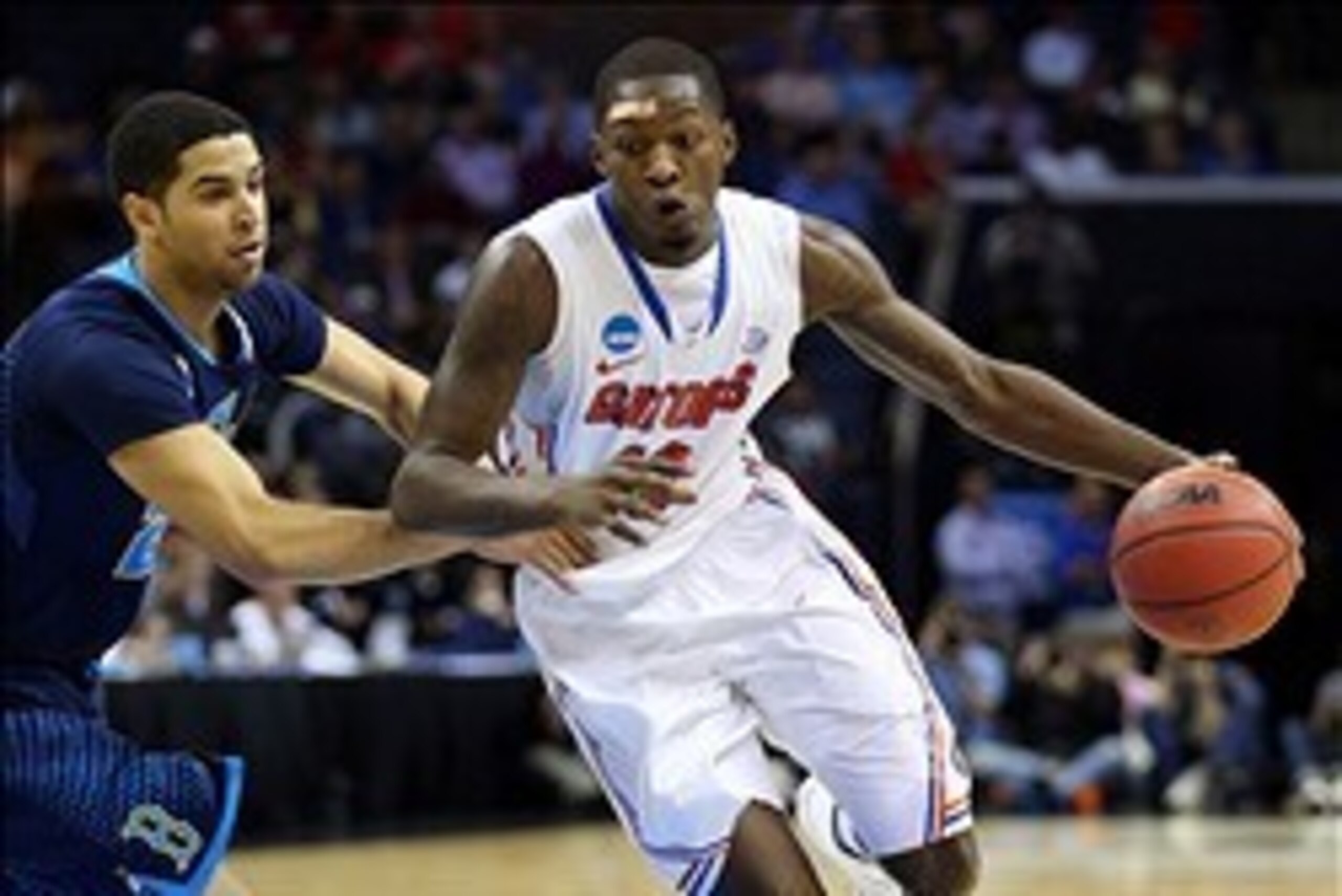 Mar 27, 2014; Memphis, TN, USA; Florida Gators forward Dorian Finney-Smith (10) drives against UCLA Bruins guard/forward Noah Allen (22) during the first half in the semifinals of the south regional of the 2014 NCAA Mens Basketball Championship tournament
