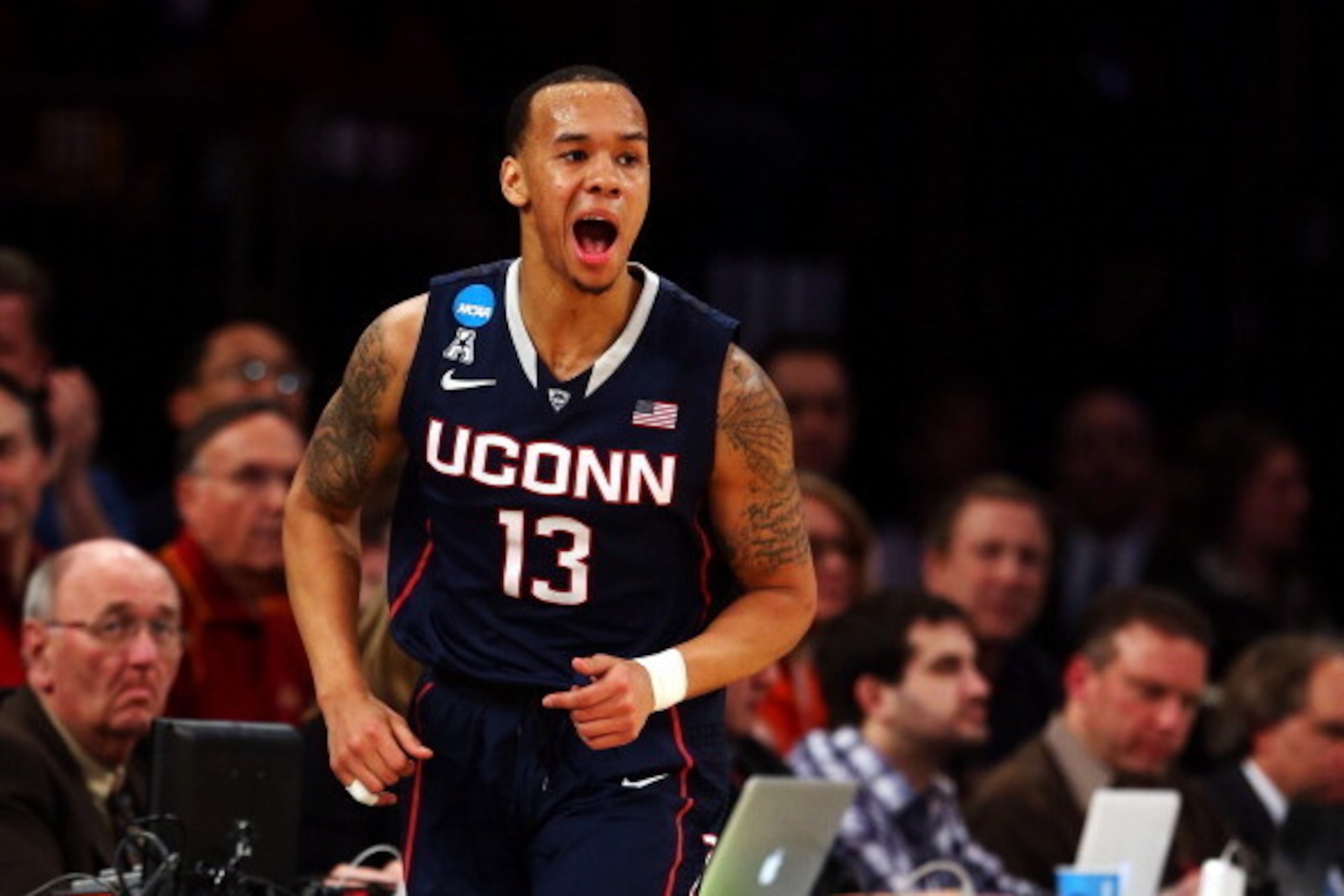NEW YORK, NY - MARCH 28:  Shabazz Napier #13 of the Connecticut Huskies reacts after hitting a three pointer in the first half against the Iowa State Cyclones during the regional semifinal of the 2014 NCAA Men's Basketball Tournament at Madison Square Gar