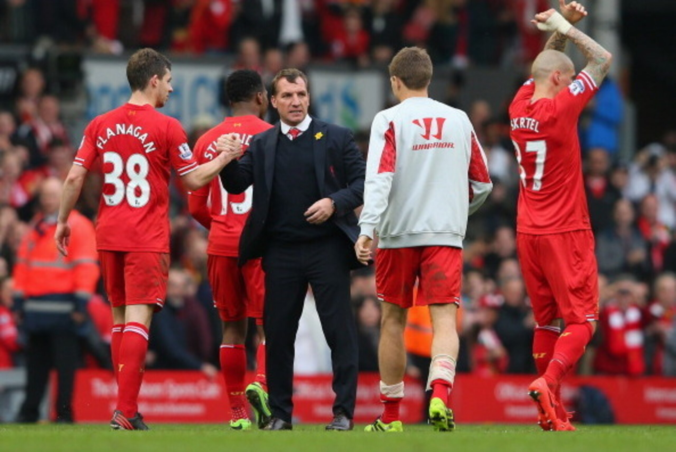 LIVERPOOL, ENGLAND - MARCH 30:  Liverpool Manager Brendan Rodgers congratulates Jon Flanagan and Steven Gerrard of Liverpool at the end of the Barclays Premier League match between Liverpool and Tottenham Hotspur at Anfield on March 30, 2014 in Liverpool,
