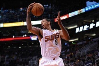 Feb 23, 2014; Phoenix, AZ, USA; Phoenix Suns power forward Channing Frye (8) grabs a rebound against the Houston Rockets during the first half at US Airways Center. Mandatory Credit: Joe Camporeale-USA TODAY Sports