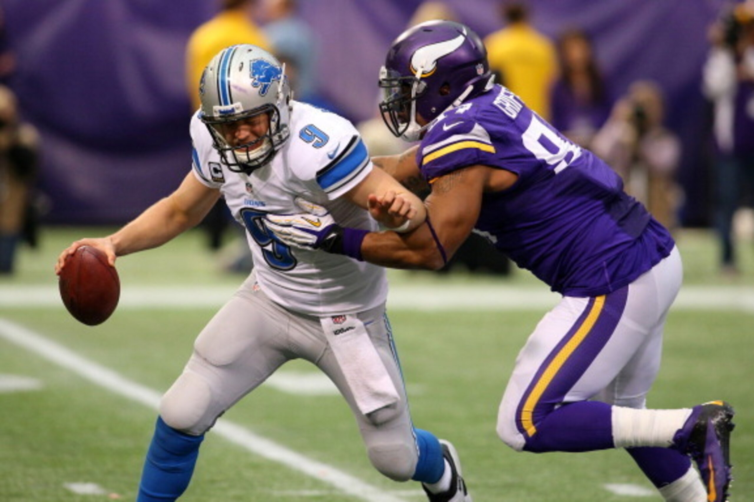 MINNEAPOLIS, MN - DECEMBER 29:  Matthew Stafford #9 of the Detroit Lions gets sacked by Everson Griffen #97 of the Minnesota Vikings on December 29, 2013 at Mall of America Field at the Hubert H. Humphrey Metrodome in Minneapolis, Minnesota. (Photo by Ada