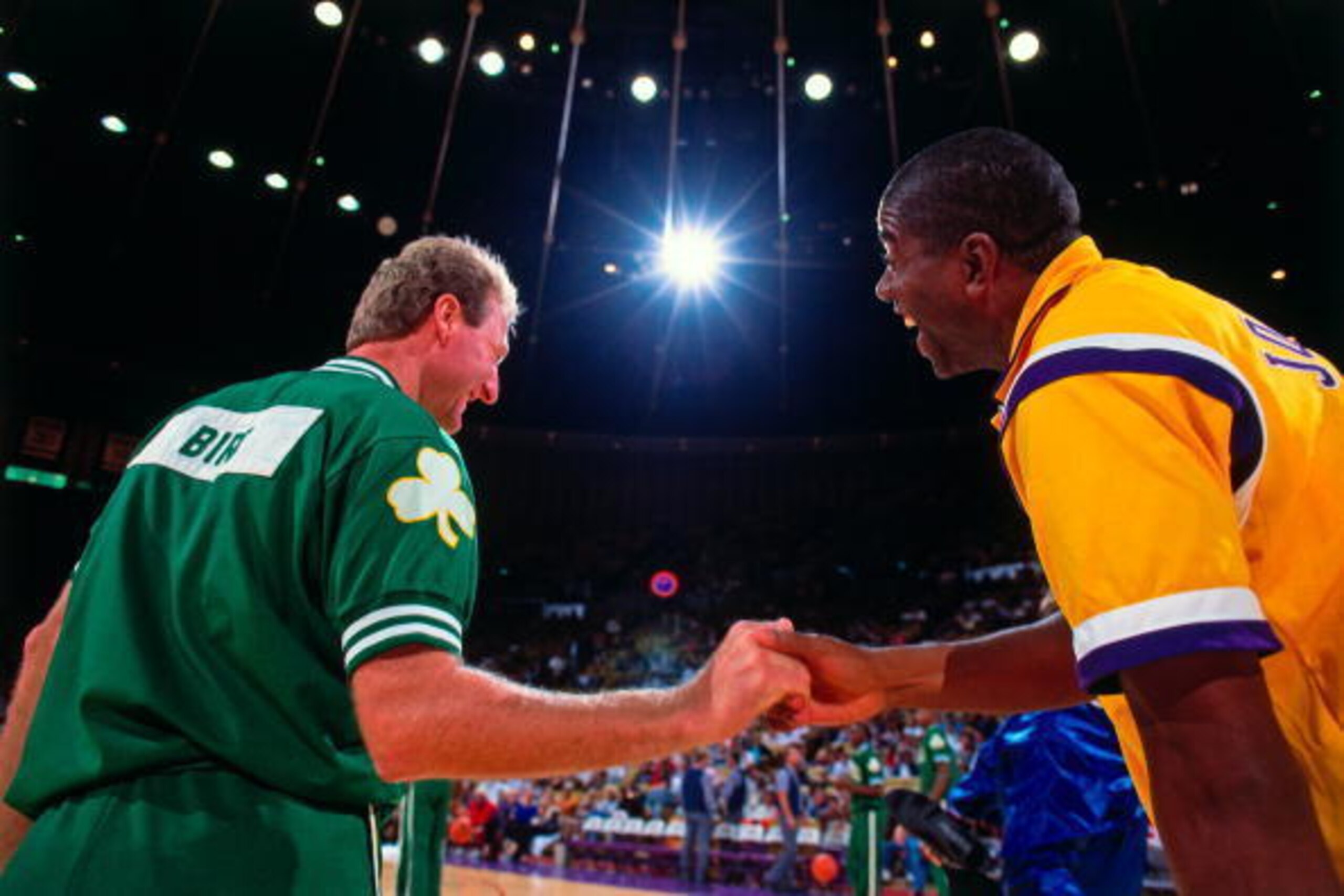 INGLEWOOD, CA - 1991:  Magic Johnson #32 of the Los Angeles Lakers greets Larry Bird #33 of the Boston Celtics prior to the games during the 1991 NBA season at The Great Western Forum in Inglewood, California. NOTE TO USER: User expressly acknowledges and