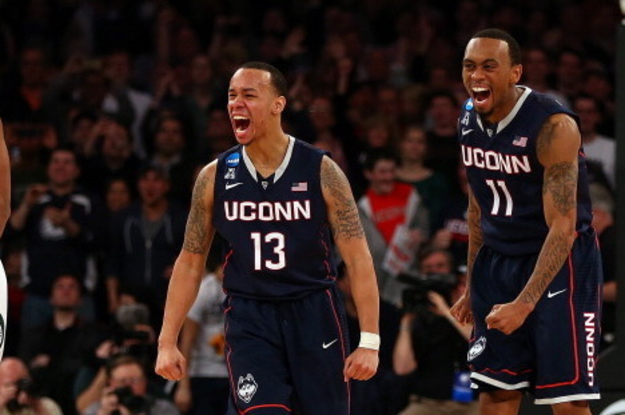 NEW YORK, NY - MARCH 30:  Shabazz Napier #13 and Ryan Boatright #11 of the Connecticut Huskies reacts after a play late in the game against the Michigan State Spartans during the East Regional Final of the 2014 NCAA Men's Basketball Tournament at Madison 