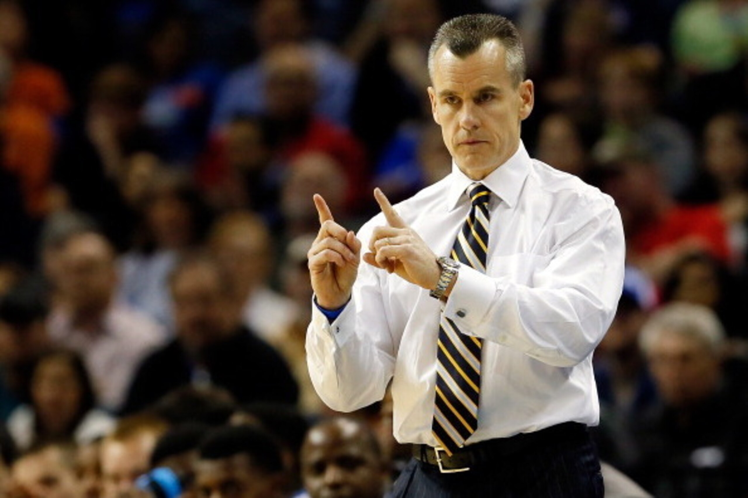 MEMPHIS, TN - MARCH 29:  Head coach Billy Donovan of the Florida Gators motions to his players during the south regional final of the 2014 NCAA Men's Basketball Tournament against the Dayton Flyers at the FedExForum on March 29, 2014 in Memphis, Tennessee