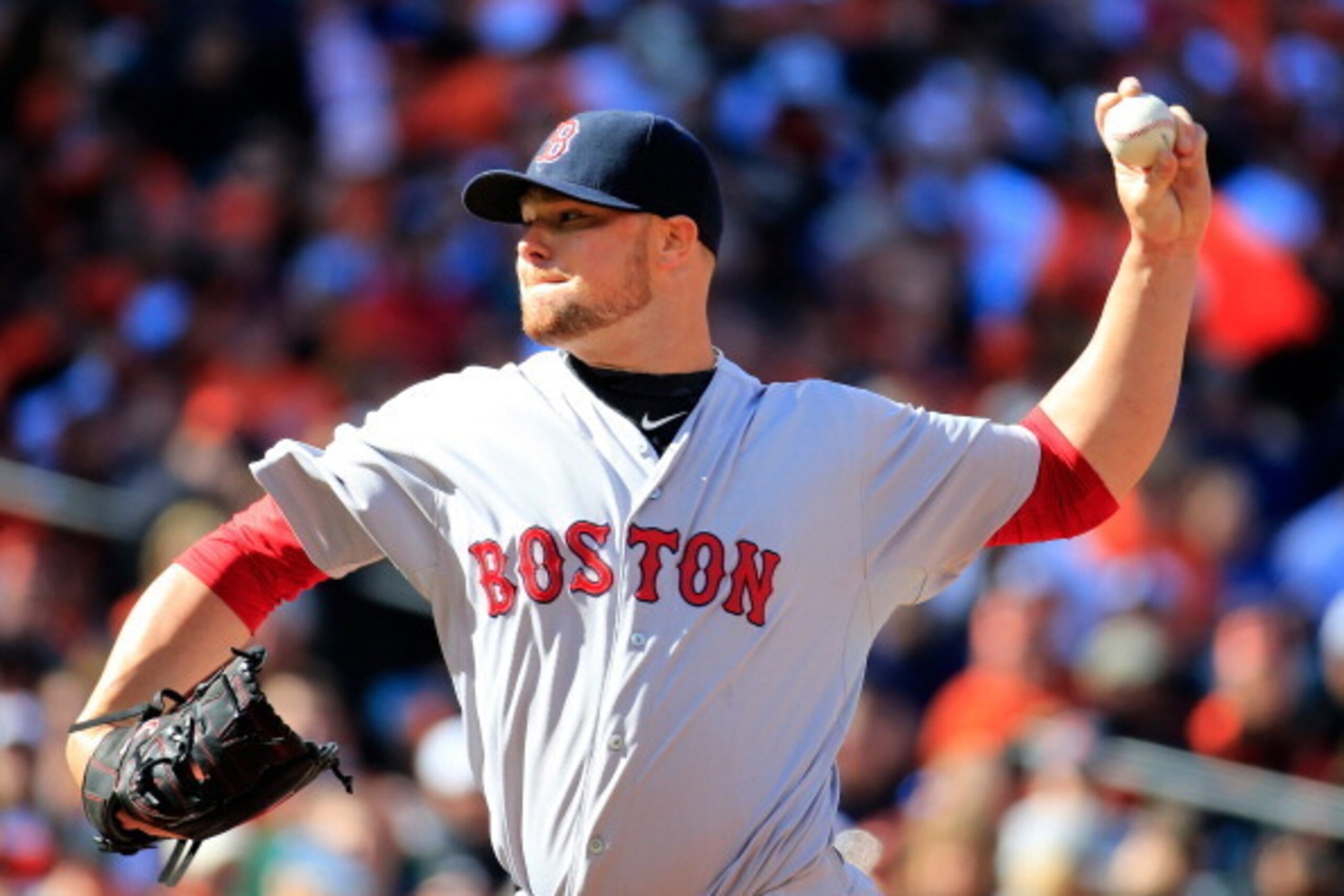 BALTIMORE, MD - MARCH 31:  Starting pitcher Jon Lester #31 of the Boston Red Sox throws a pitch to a Baltimore Orioles batter during the first inning of Opening Day at Oriole Park at Camden Yards on March 31, 2014 in Baltimore, Maryland.  (Photo by Rob Ca